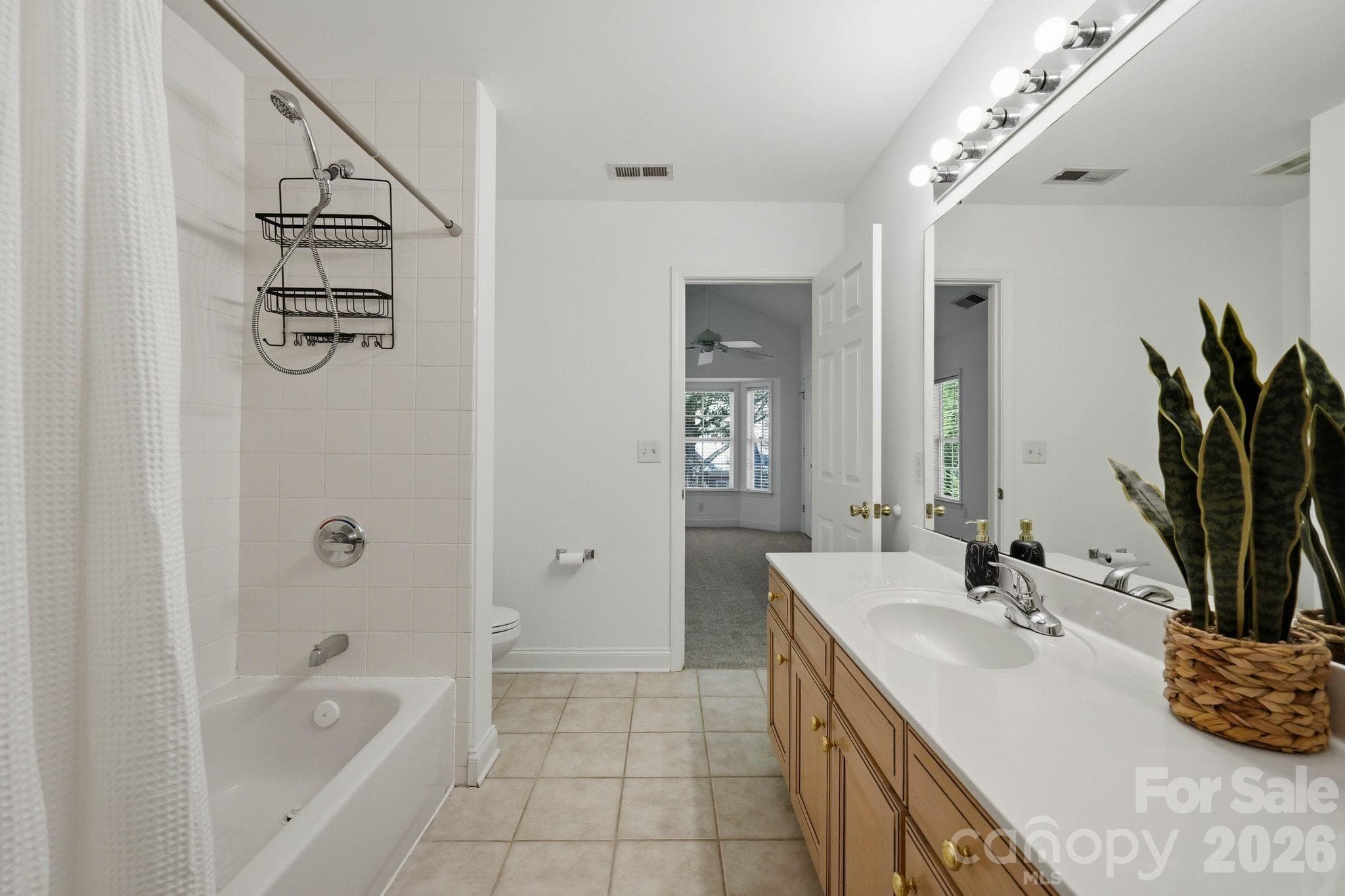 Bright upstairs bathroom offers a functional layout for guests and secondary bedrooms. - 18810 Cloverstone Circle, Cornelius