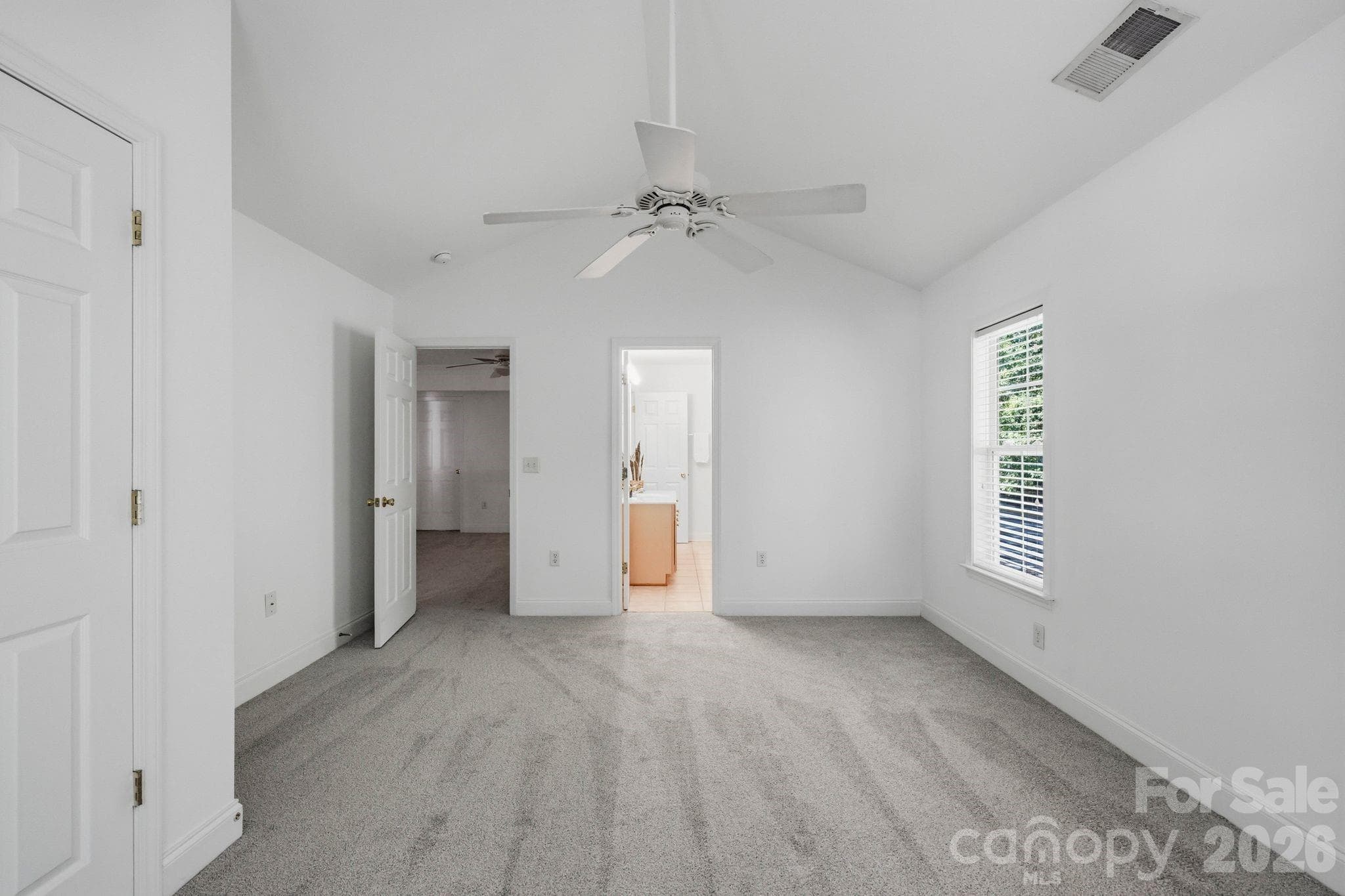 Upstairs bedroom provides comfortable space for guests, work-from-home use, or hobbies. - 18810 Cloverstone Circle, Cornelius