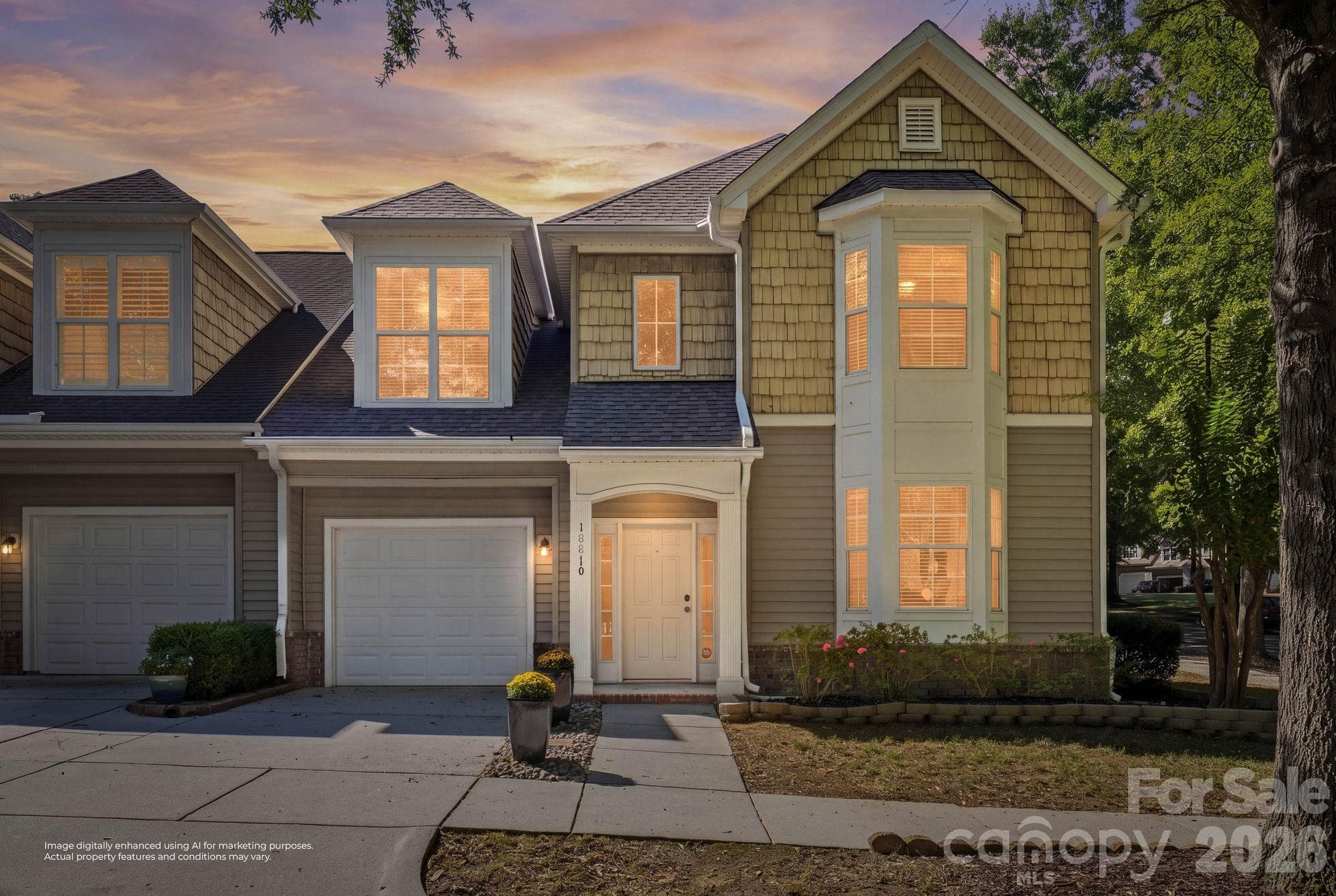 Virtual twilight view highlights the home’s welcoming exterior and end-unit setting in established Edinburgh Square. - 18810 Cloverstone Circle, Cornelius