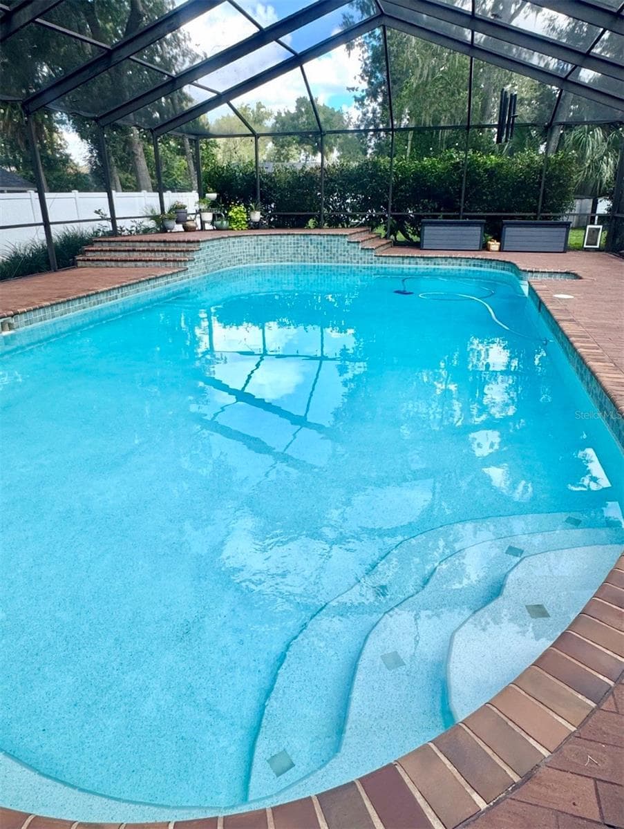 Relax in the beautiful 40x20 resort-style Pool and Spa.  The enormous screened-in lanai is perfect for large gatherings. - 4603 DOGWOOD HILLS CT, BRANDON
