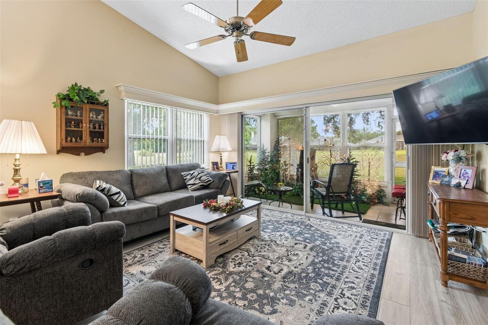 Living room with view to lanai - 5213 LOCHMEAD TER, ZEPHYRHILLS