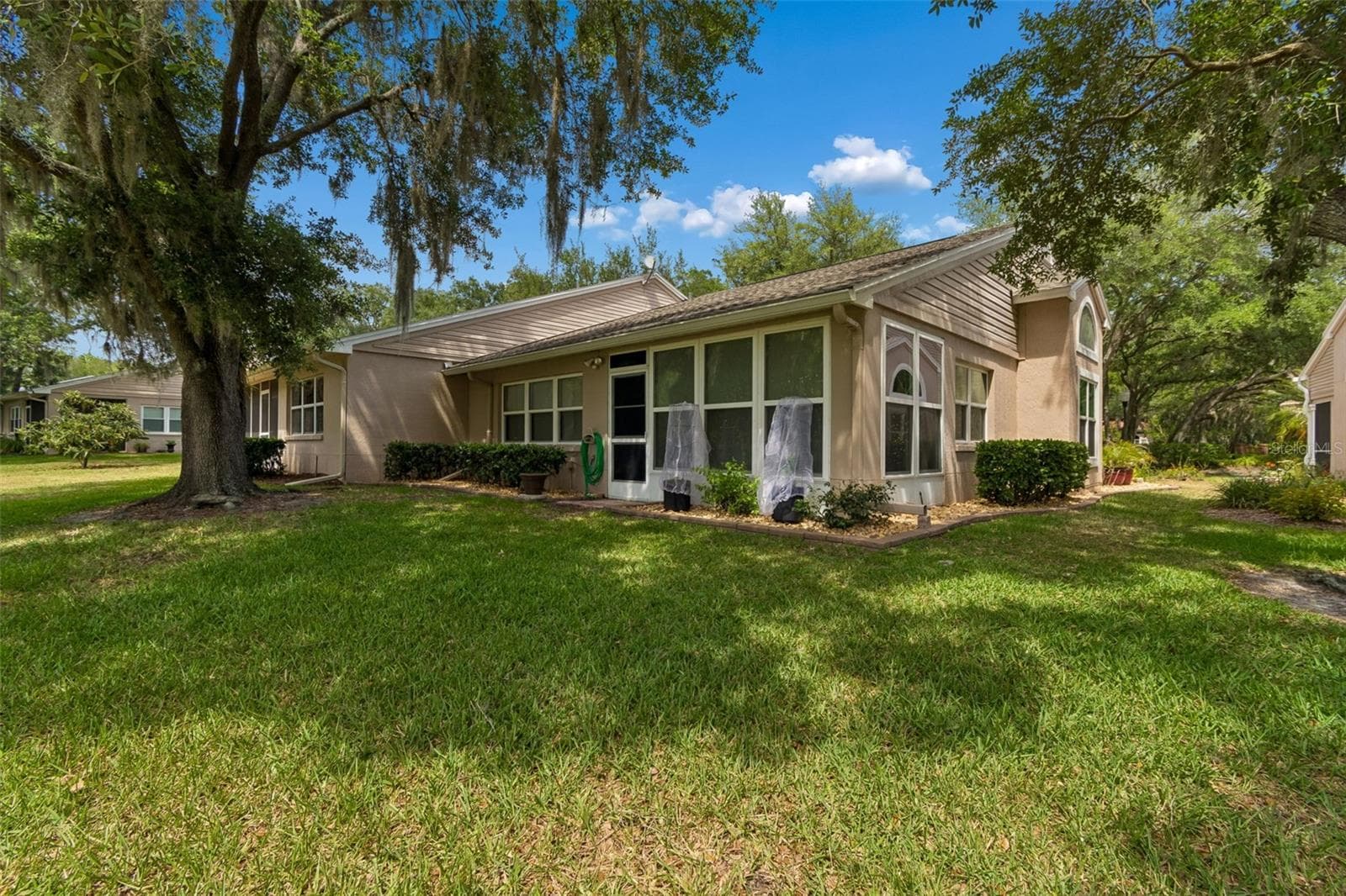 Side of villa - 5213 LOCHMEAD TER, ZEPHYRHILLS