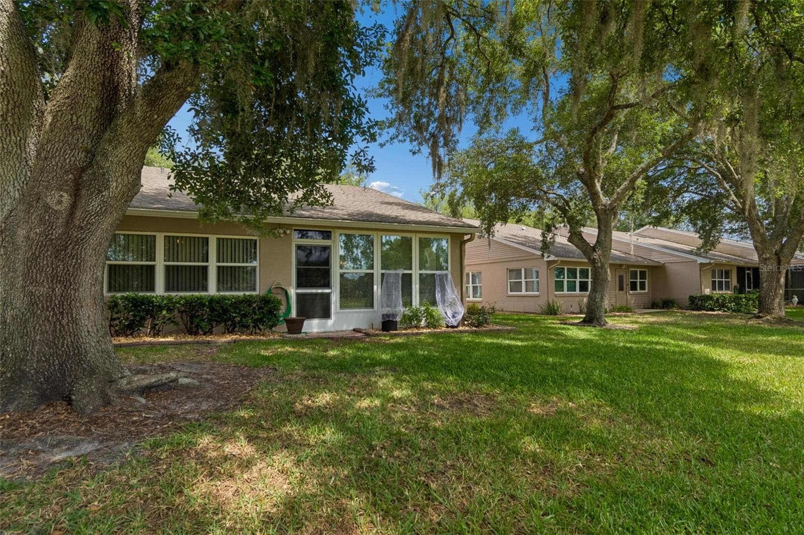 Back of villa - 5213 LOCHMEAD TER, ZEPHYRHILLS