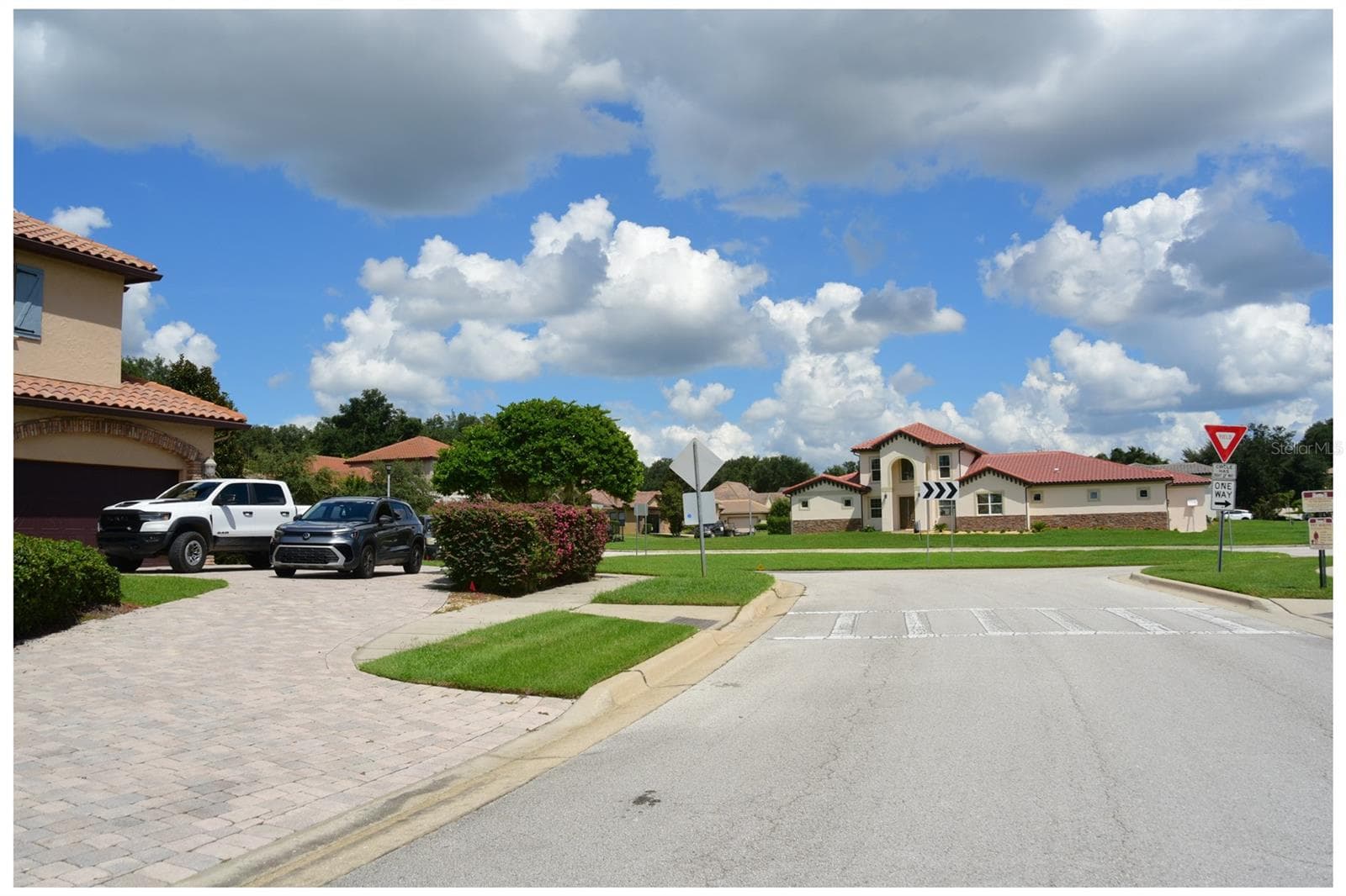 Looking into neighborhood from entrance - 12914 BRUNELLO CIR, CLERMONT