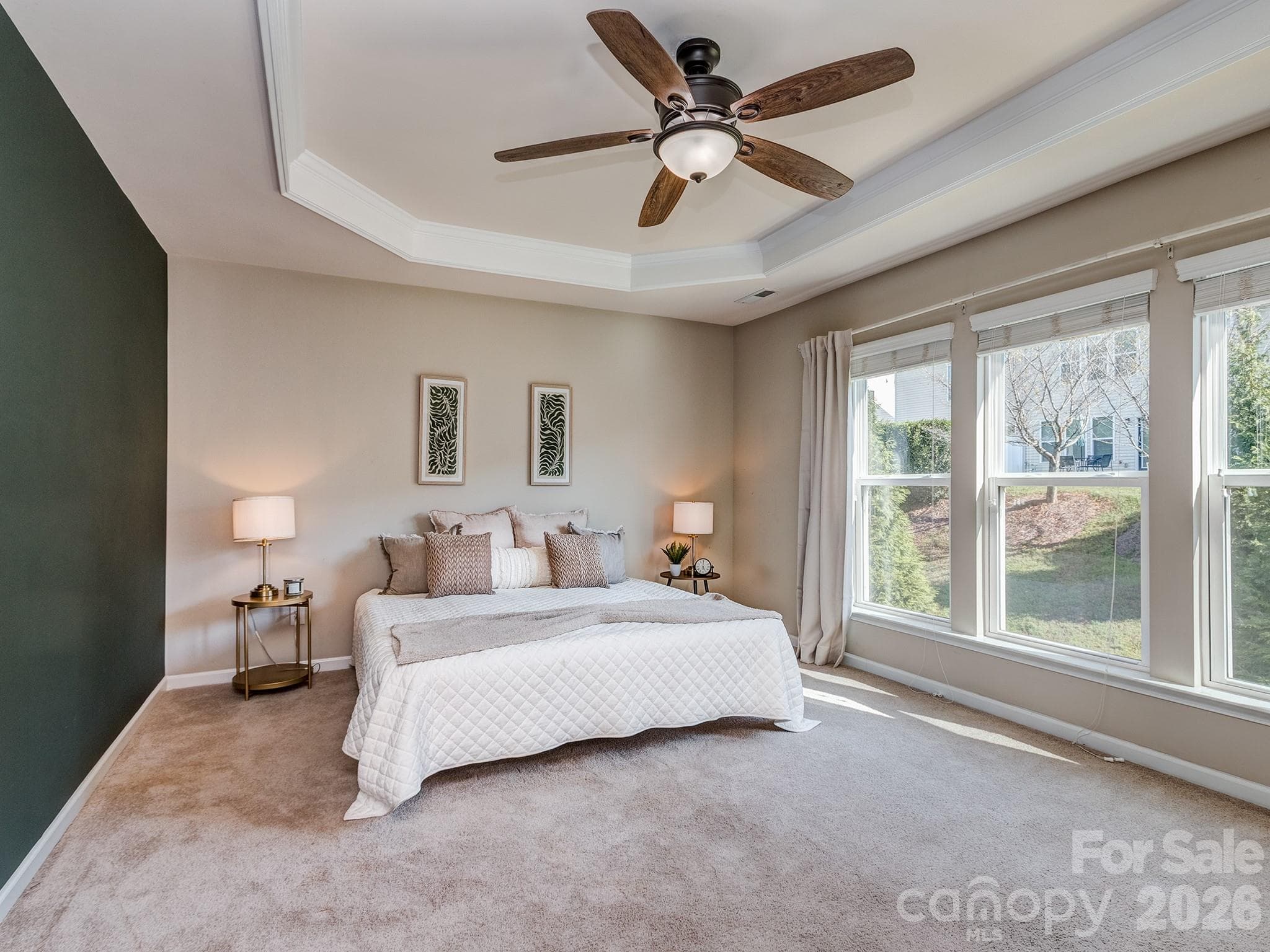 Primary Bedroom with tray ceilings and accent wall - 3831 Park South Station Boulevard, Charlotte