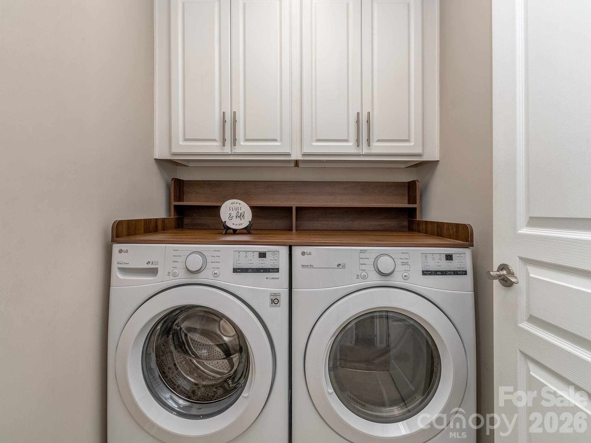 Laundry room with custom built ins - 3831 Park South Station Boulevard, Charlotte