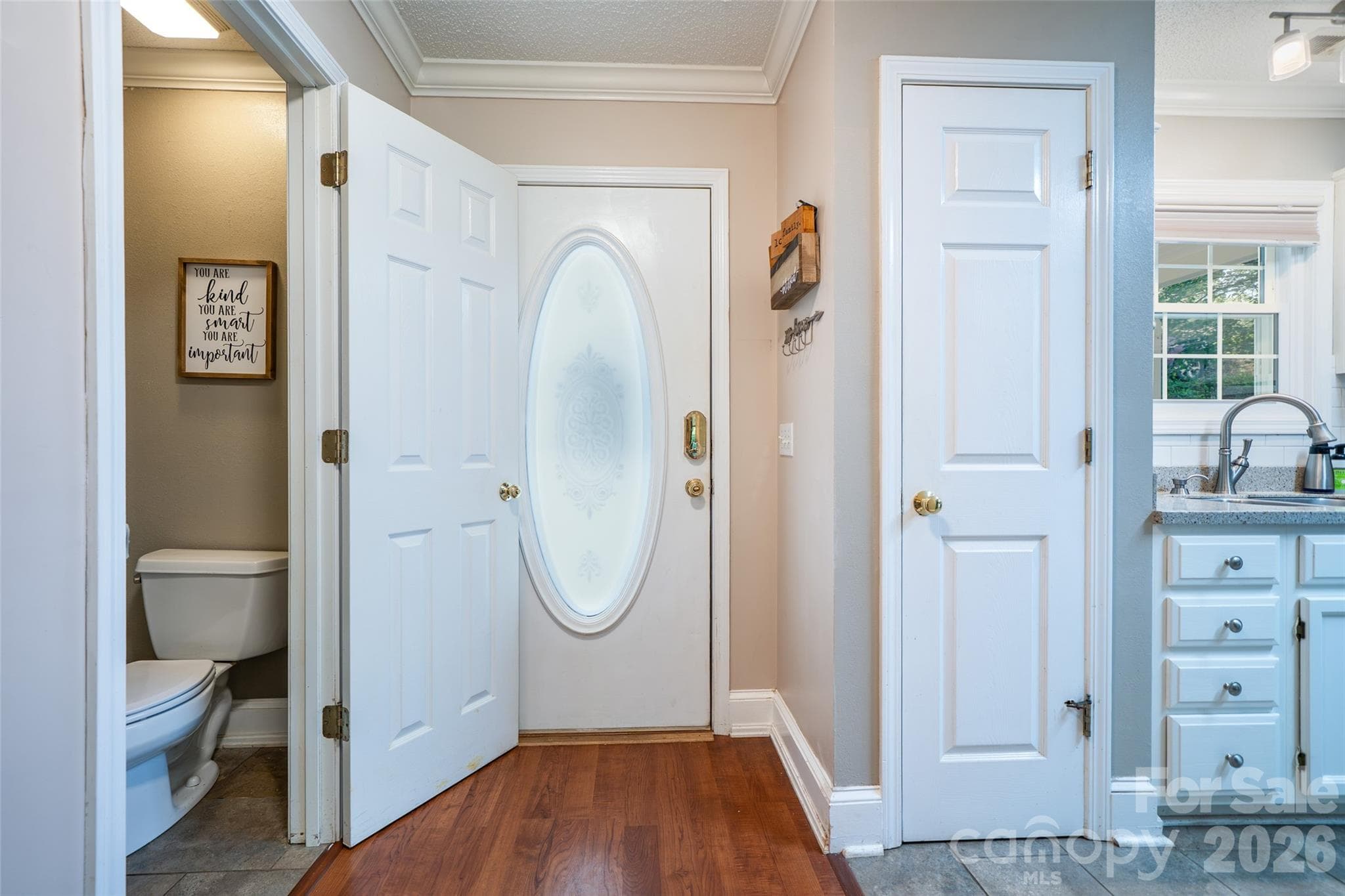 view looking at front door and 1/2 bath - 18 Friendly Way, Asheville