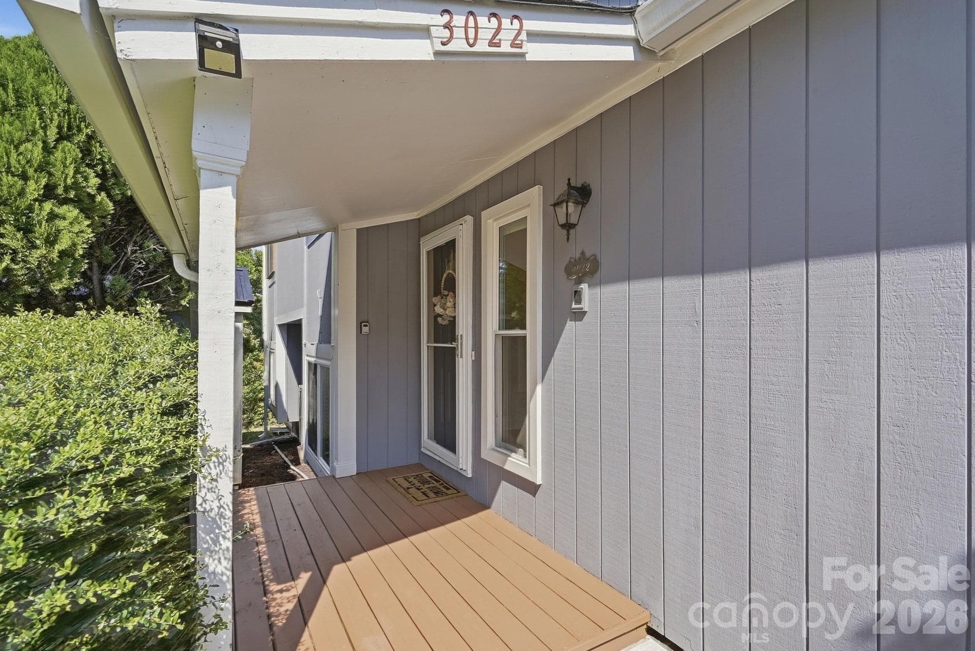 A covered front porch welcomes you home and keeps you out of the elements when bringing in the groceries! - 3022 Point Clear Drive, Tega Cay