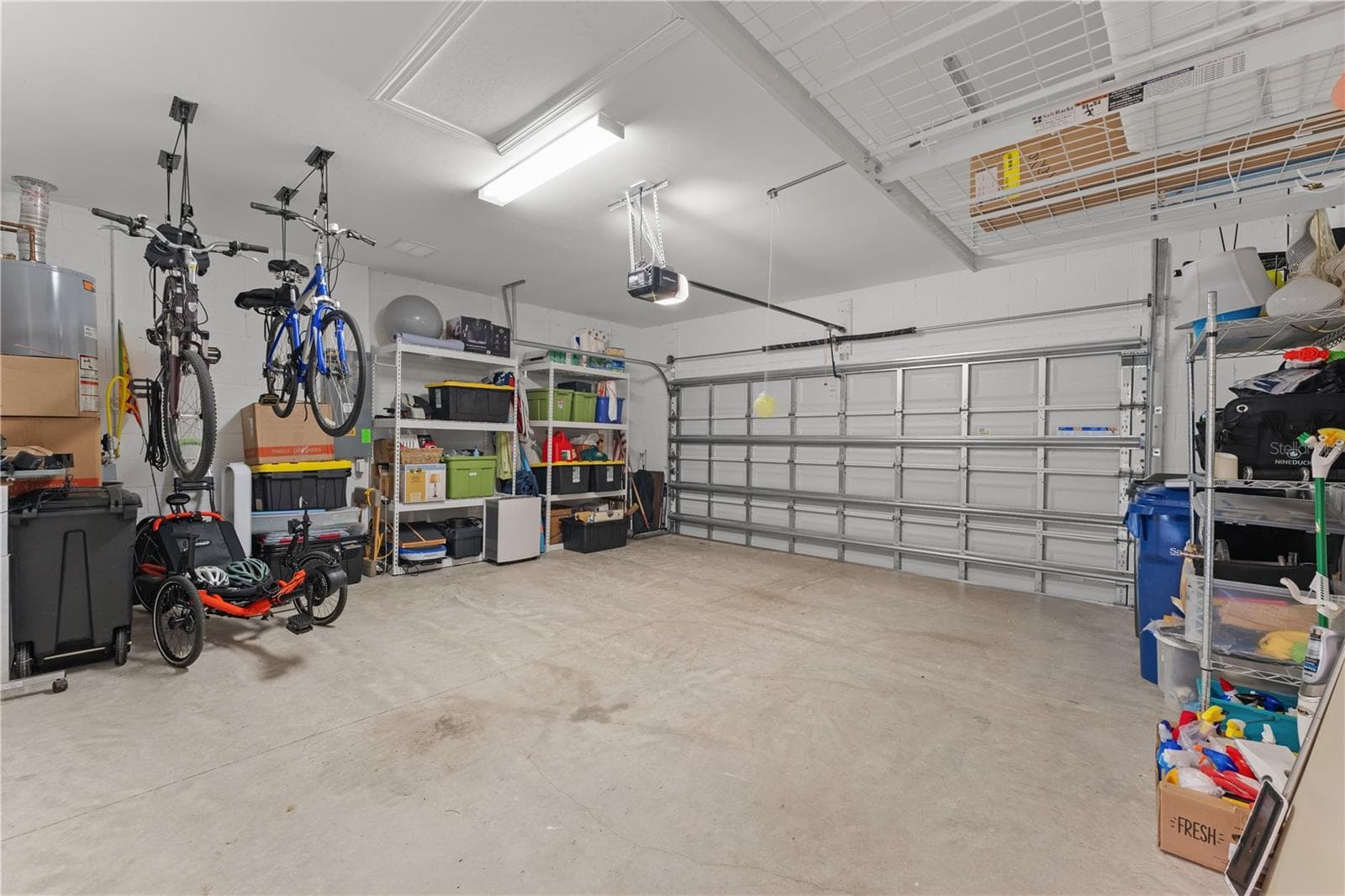 Garage with extra storage solutions. - 6332 WINDING PINE DR, NOKOMIS