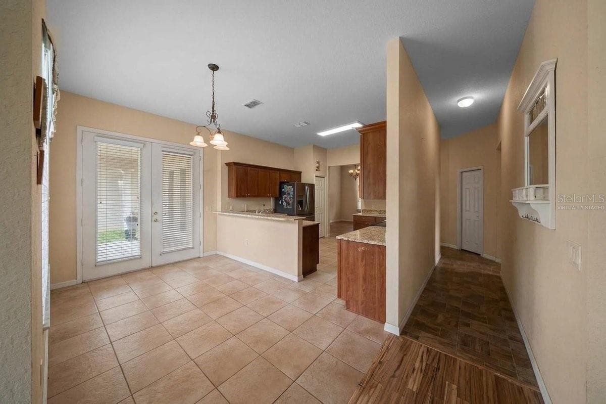 Kitchen/ Hallway to two of the four bedrooms Virtually Staged - 6310 SE 96TH ST, BELLEVIEW