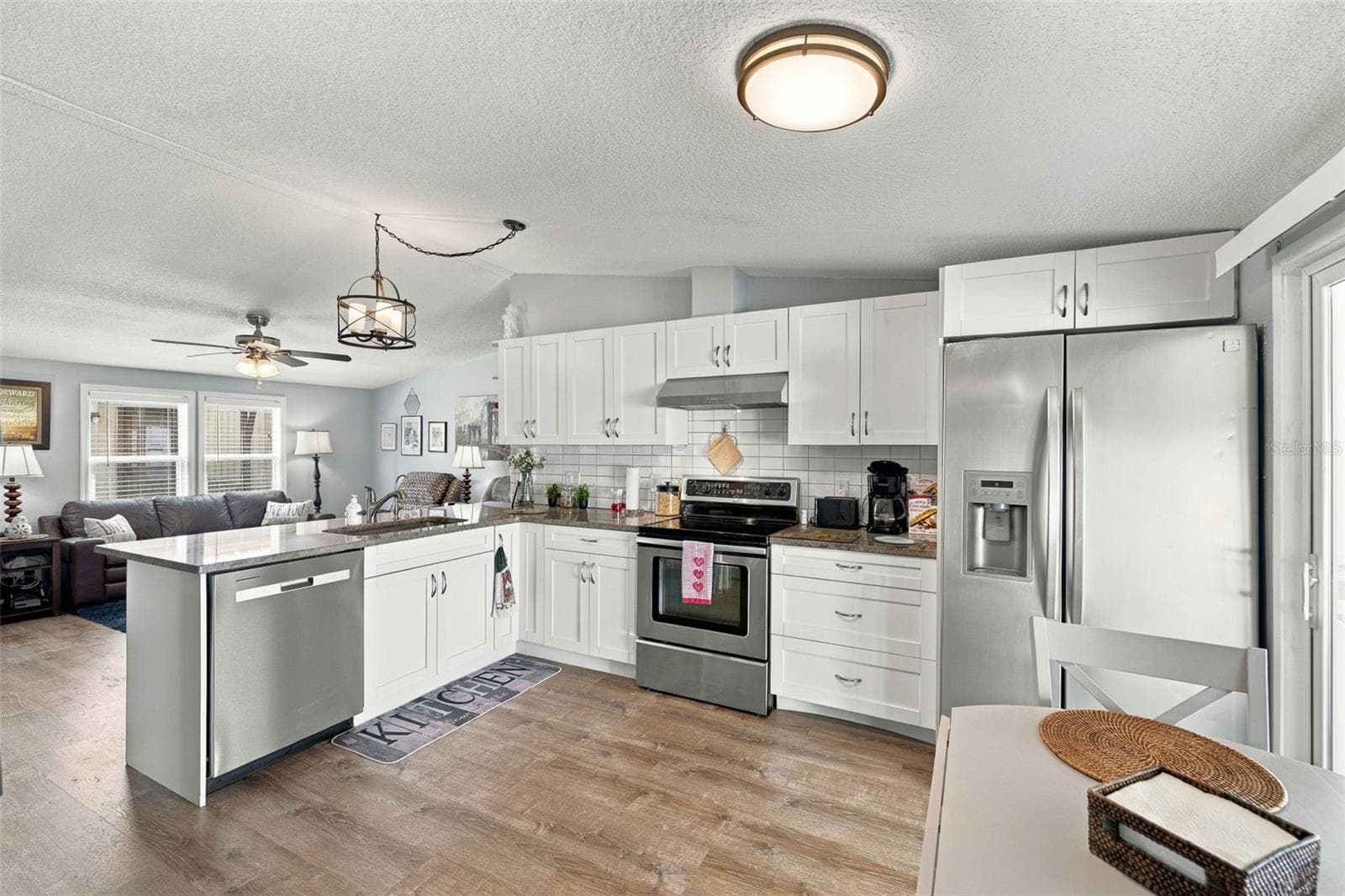 Kitchen also features an area for a table, as well as bar seating. - 3041 SHORT LEAF ST, WESLEY CHAPEL