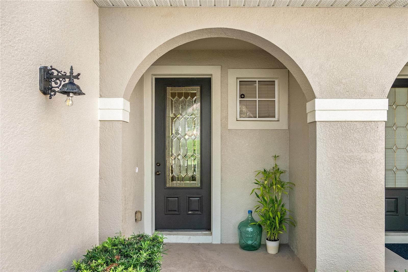 tall glass front door - 104 CANTERBURY BELL DR, OVIEDO