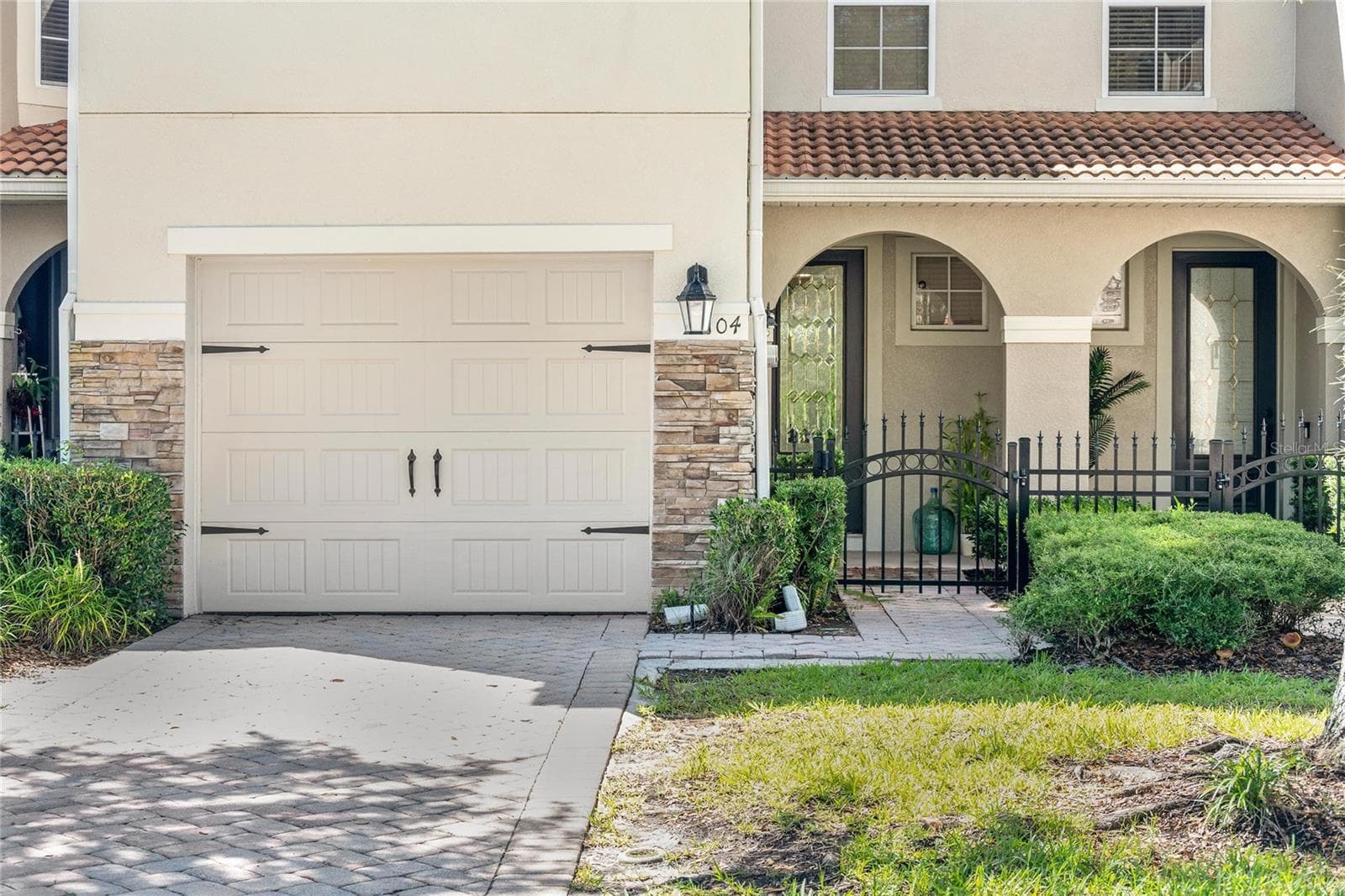 mediterranean flare is a welcome sight when pulling in your drive - 104 CANTERBURY BELL DR, OVIEDO