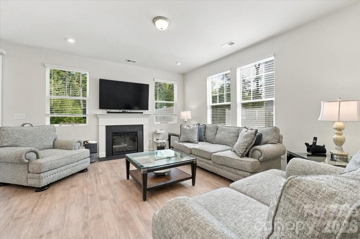 large family room with gas fireplace - 8036 Overmeadow Lane, Charlotte