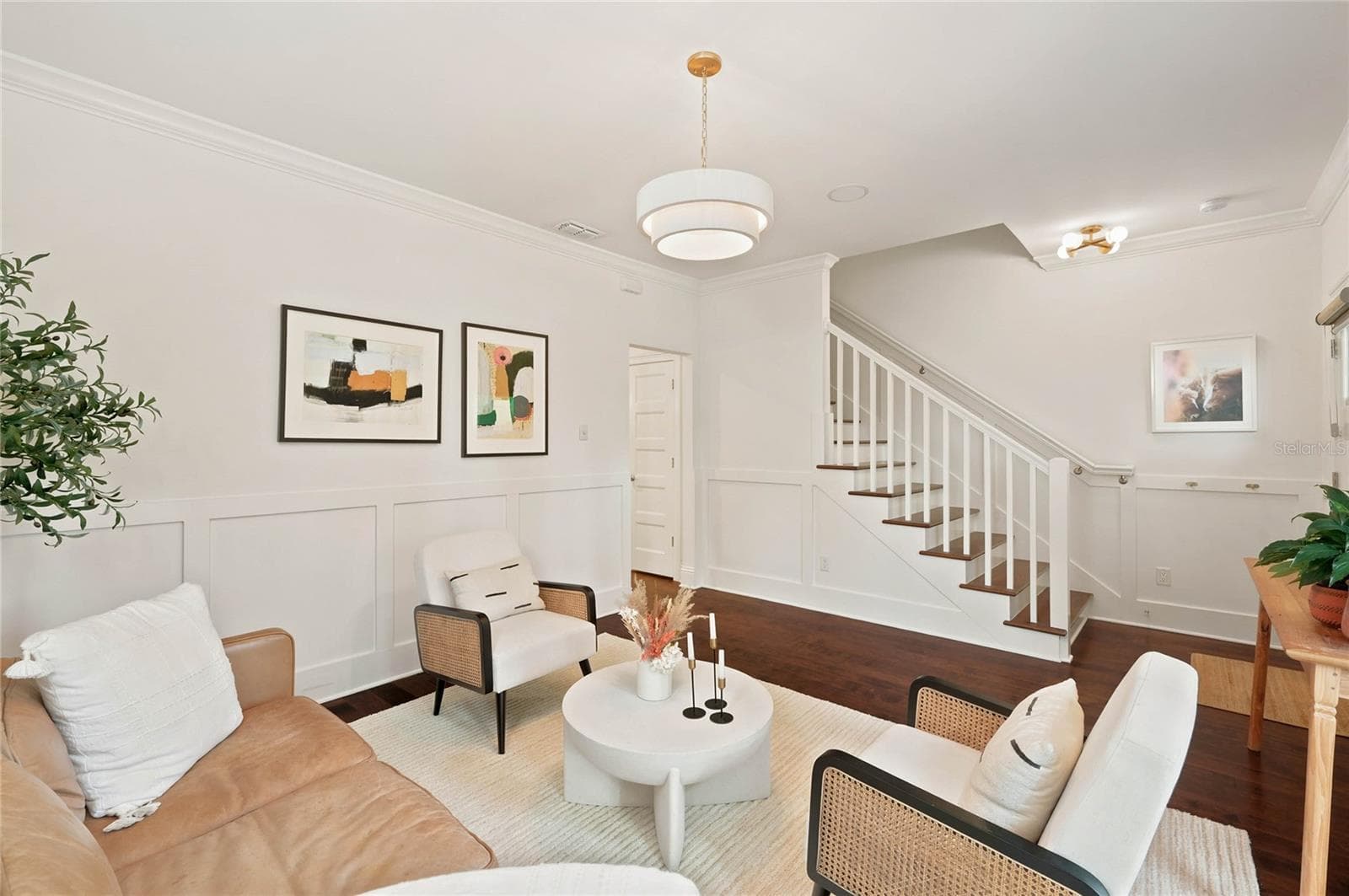 Custom wainscoting, detail moldings and designer light fixture all add to the character of the space - 1707 ASHER LN, ORLANDO