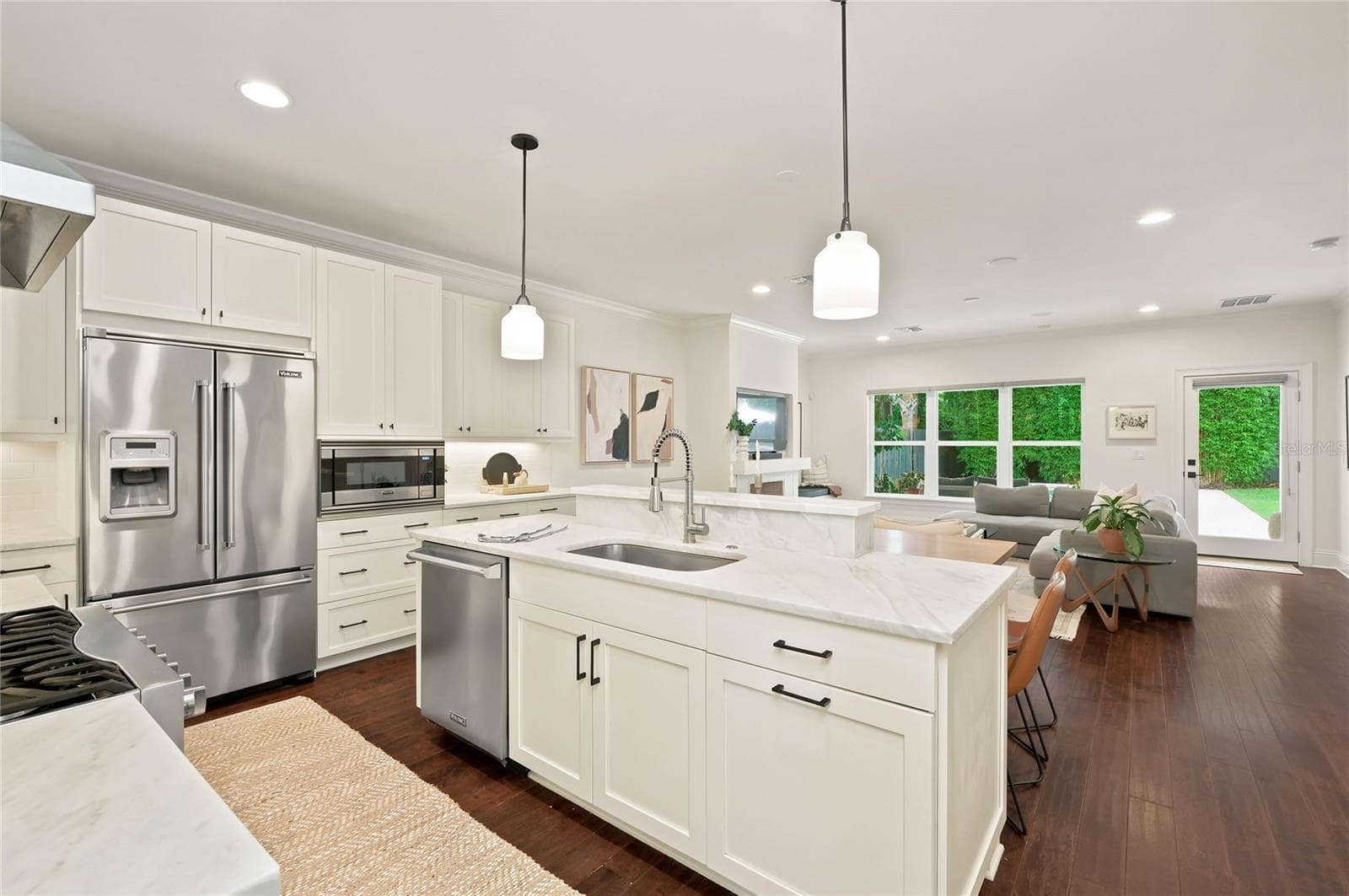 Sophisticated open Kitchen with marble countertops and white cabinetry - 1707 ASHER LN, ORLANDO