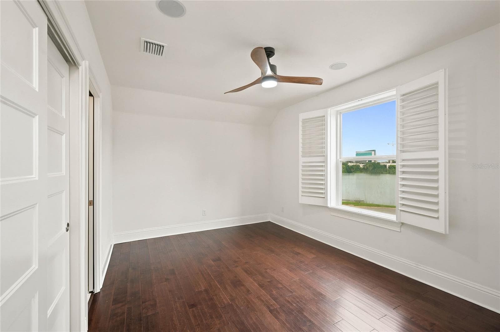 Bedroom 2 with window overlooking Lake Formosa - 1707 ASHER LN, ORLANDO