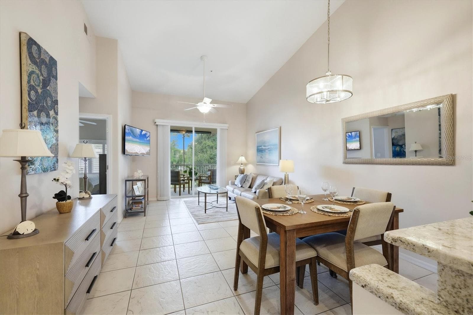 See the integration of the updated kitchen, dining and living rooms into a unified connective living area. - 4256 CENTRAL SARASOTA PKWY #325, SARASOTA