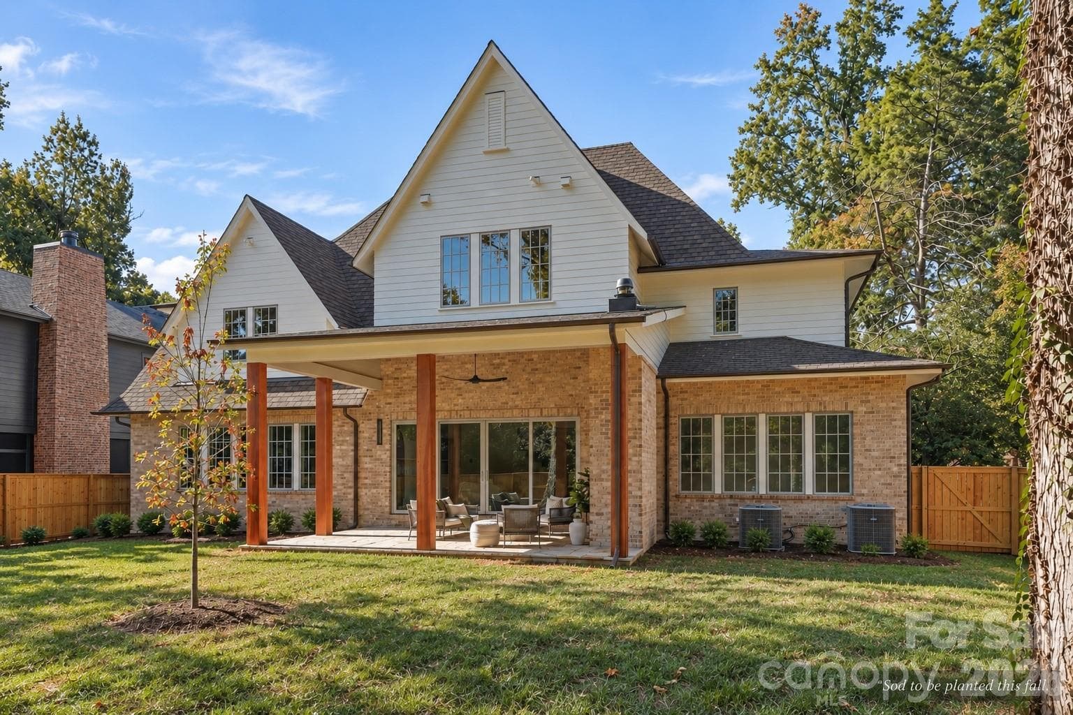 Rear / South Elevation - Covered Lanai with Wood Burning Fireplace - 110 Hunter Lane, Charlotte