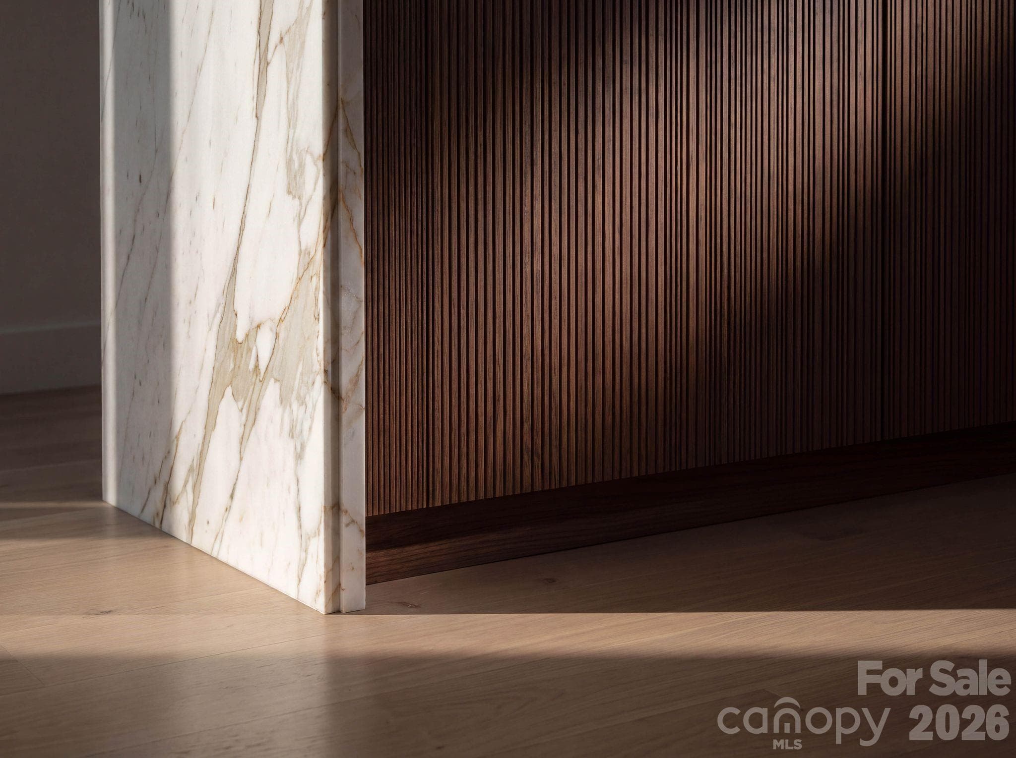 Reeded cabinet doors, marble waterfall edge profile - 110 Hunter Lane, Charlotte