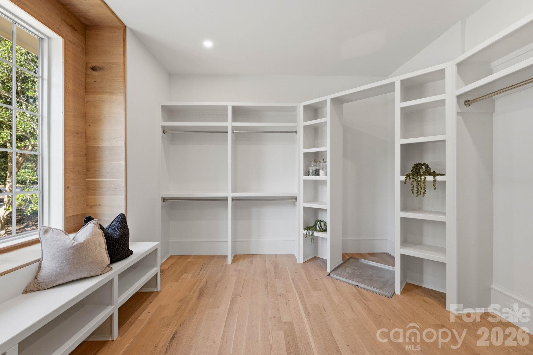 HUGE Primary Walk-in-Closet (15'x12') Custom Wood trim Window -Setup for upright Washer Dryer Combo - 110 Hunter Lane, Charlotte