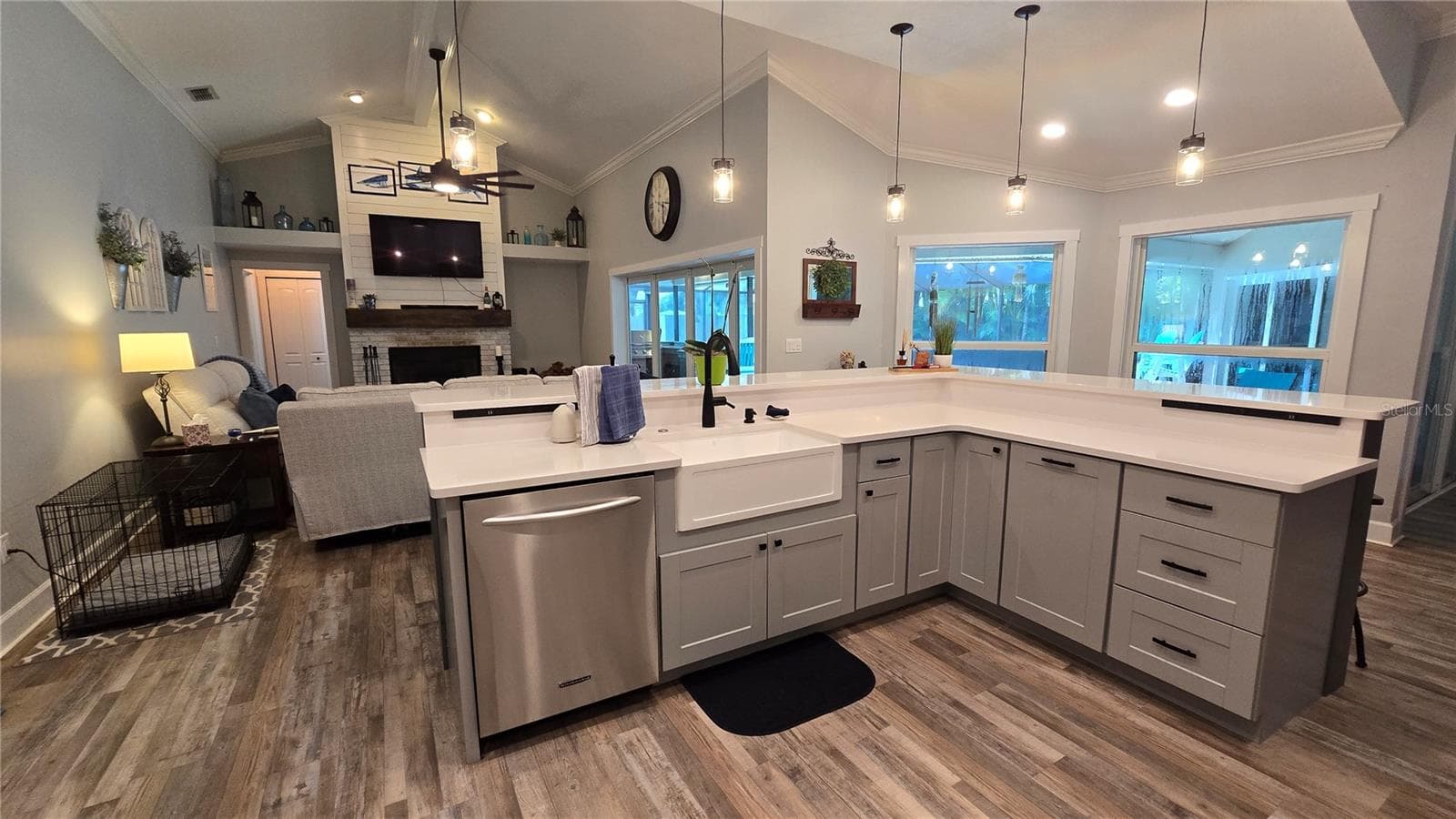 Kitchen overlooks the family room as well views of the outdoor screened in pool area.  No more missing out on the get togethers.  Lots of sitting area around the breakfast bar. - 9991 WINDTREE BLVD, SEMINOLE