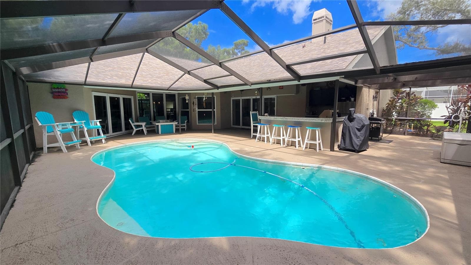 Entertainment galore right here around the pool, bar under the screened patio lanai.  This right here is what Florida is all about.  Now make this yours! - 9991 WINDTREE BLVD, SEMINOLE