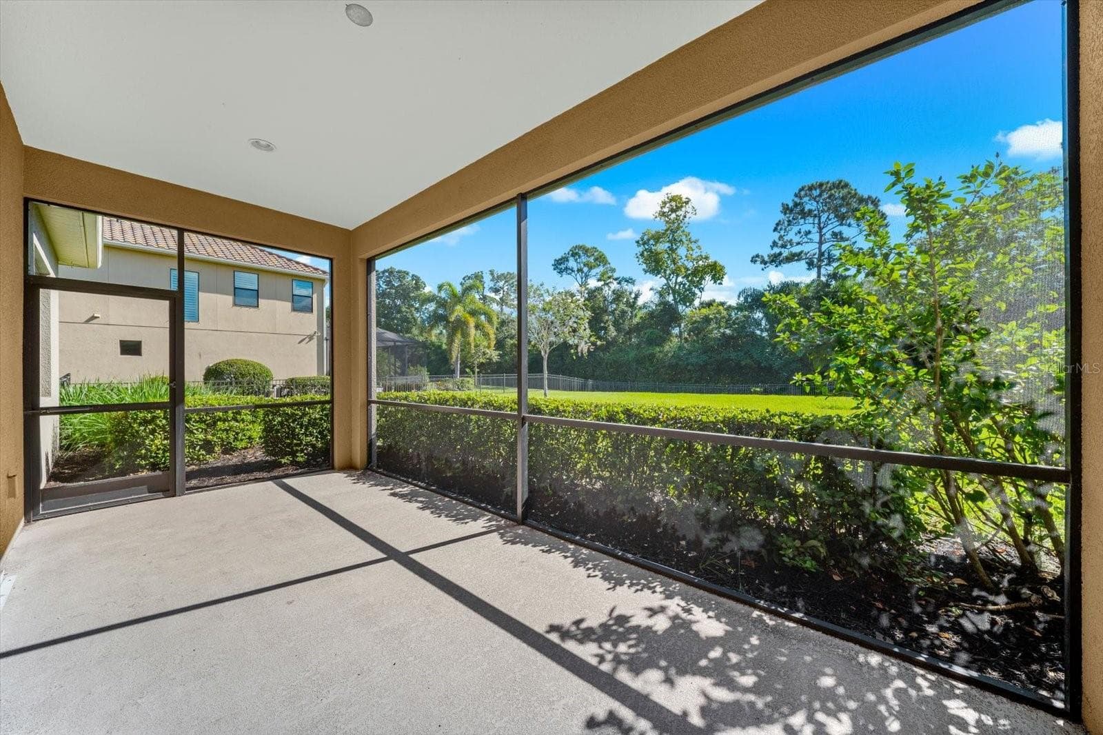 Screened In Porch Overlooking the Fenced in Back Yard - 8256 LARKSPUR CIR, SARASOTA