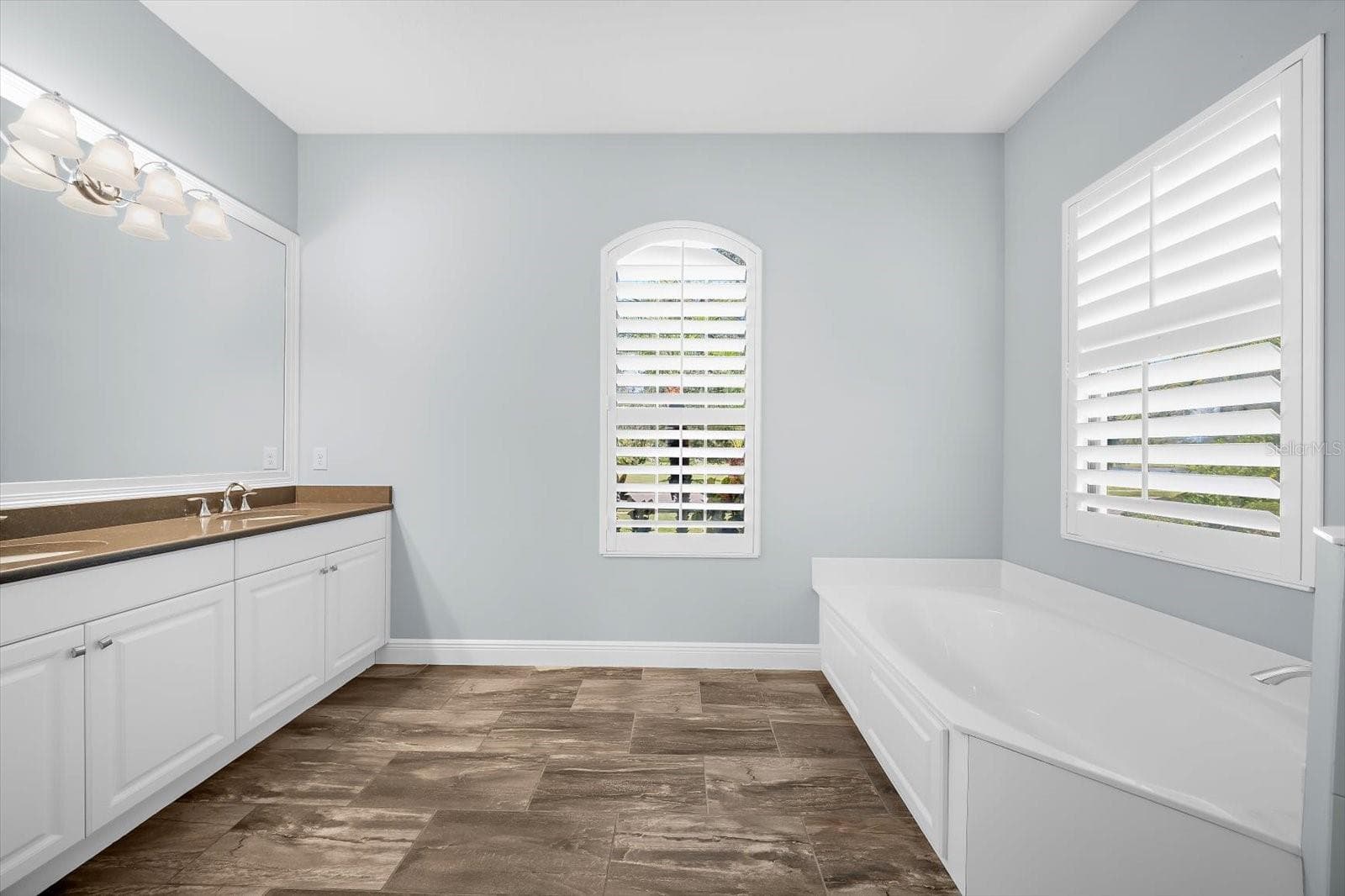 Primary Bathroom with Dual Sinks and Tub - 8256 LARKSPUR CIR, SARASOTA