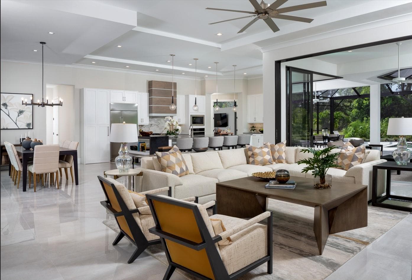 Great room, dining, kitchen - Photo of a previously built Soleil model. - 0000 SE 47TH ST, OCALA