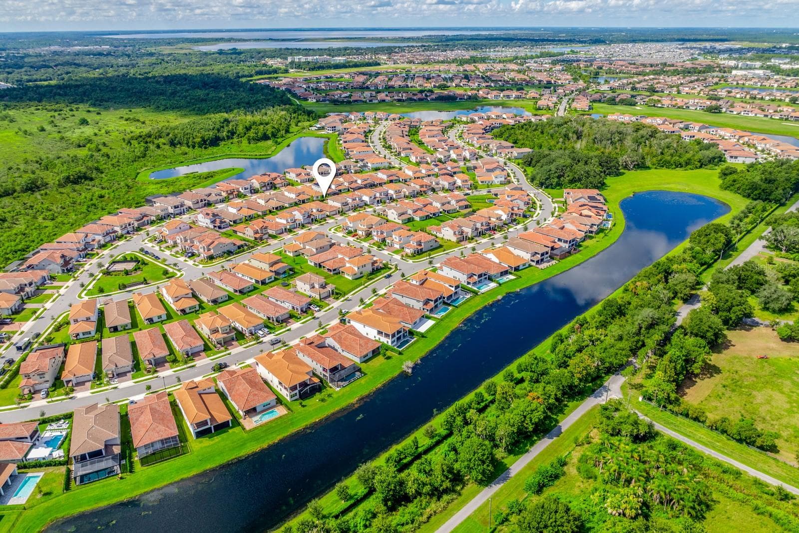 Skip the wait for new construction and enjoy a newer Lake Nona home with OWNED SOLAR, an EV CHARGER, OUTDOOR KITCHEN, FENCED YARD and exceptional Eagle Creek amenities! - 13472 PADSTOW PL, ORLANDO