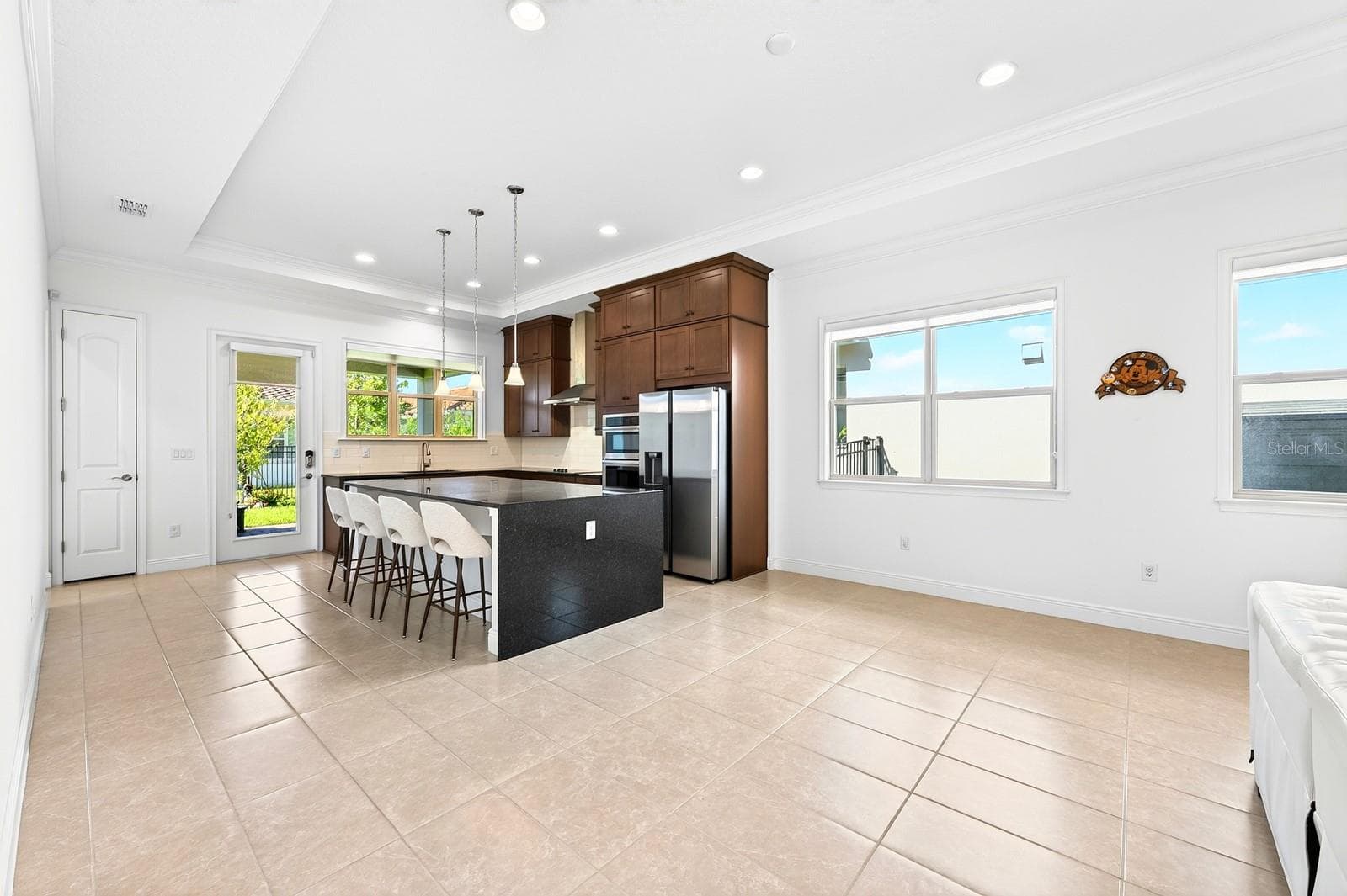 Chef's kitchen, dining space. - 13472 PADSTOW PL, ORLANDO