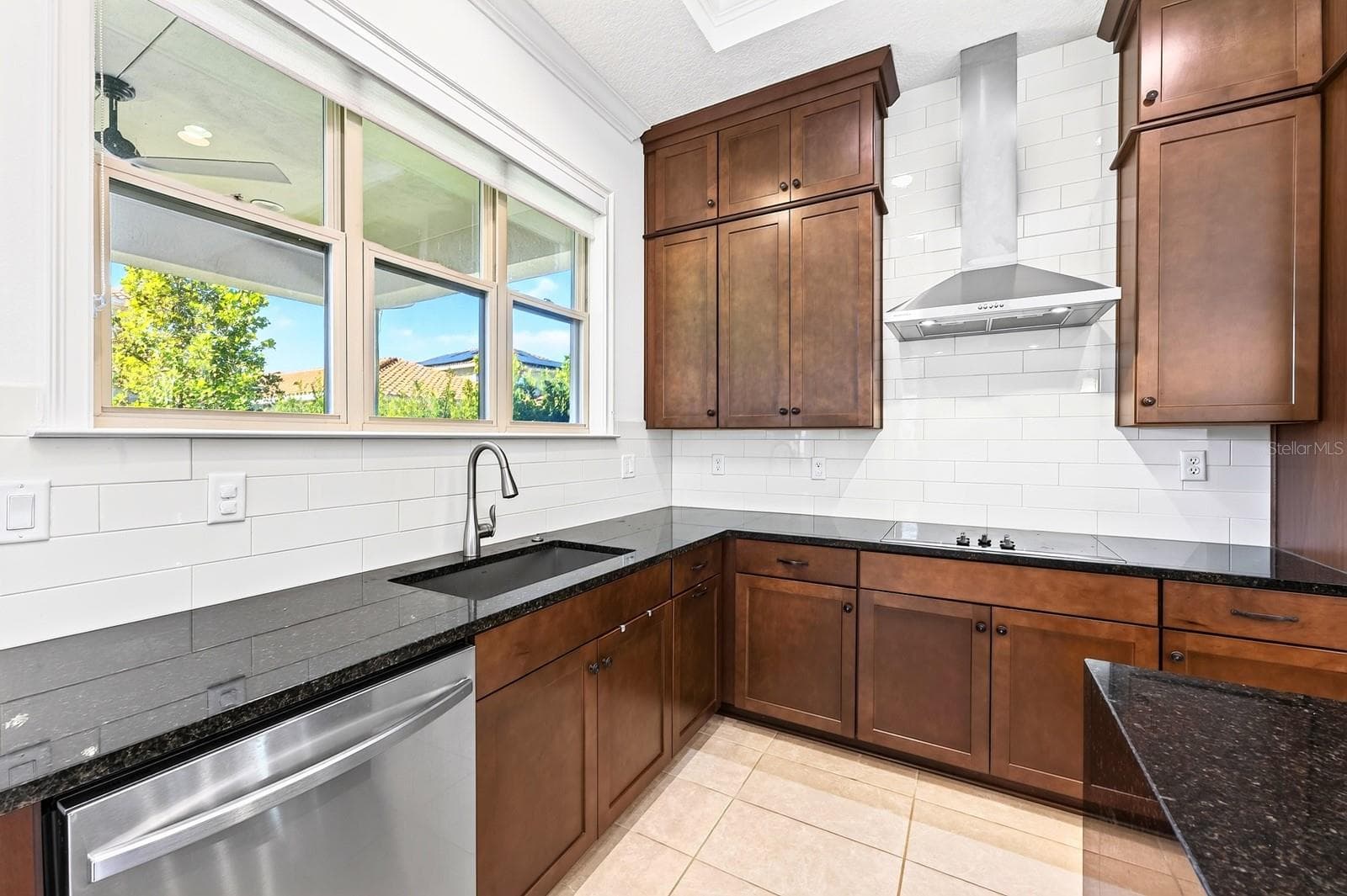 A window over the sink pulls in the natural light. - 13472 PADSTOW PL, ORLANDO