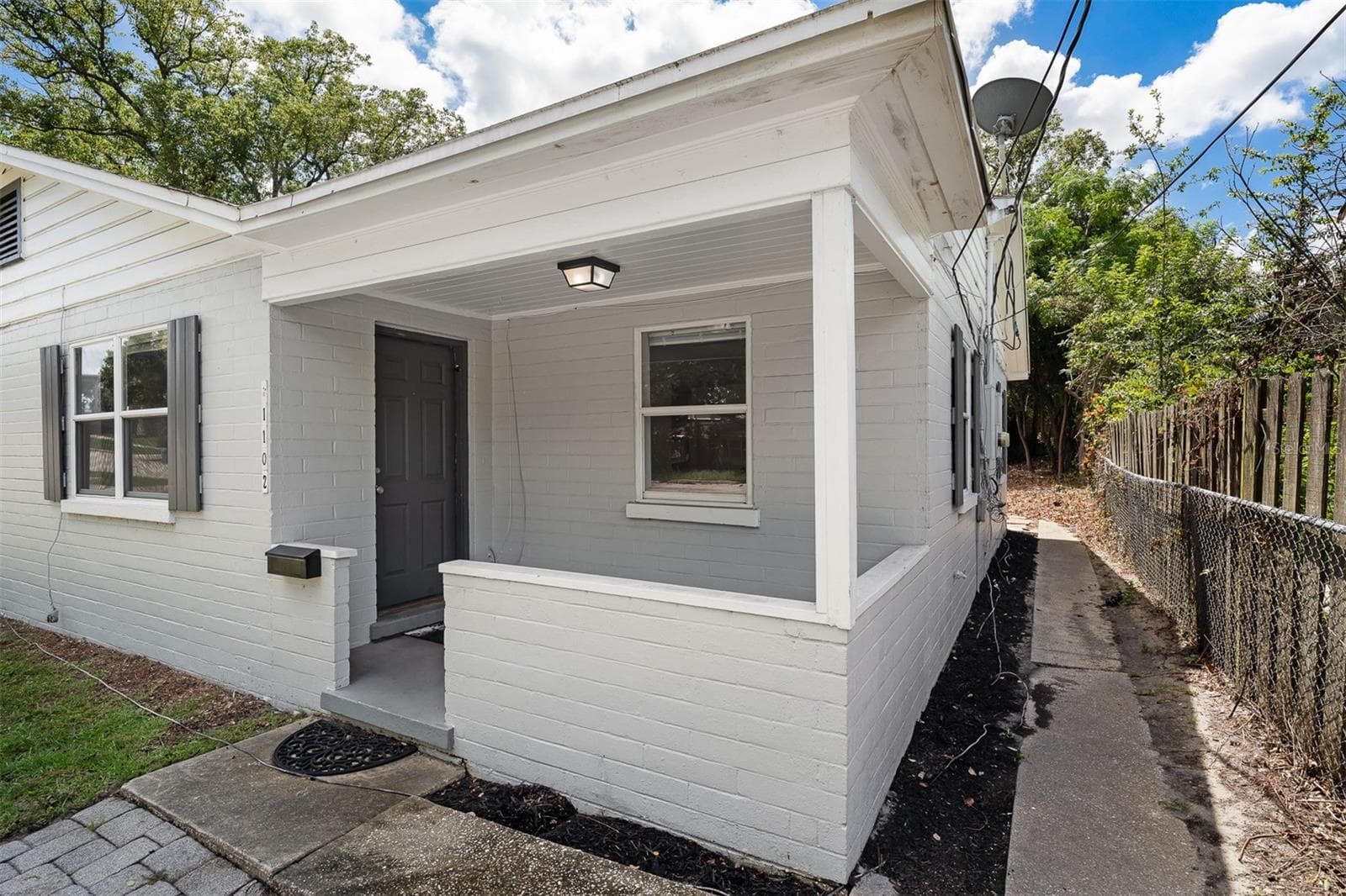 Each unit has a front porch - 1104 E HARWOOD ST, ORLANDO