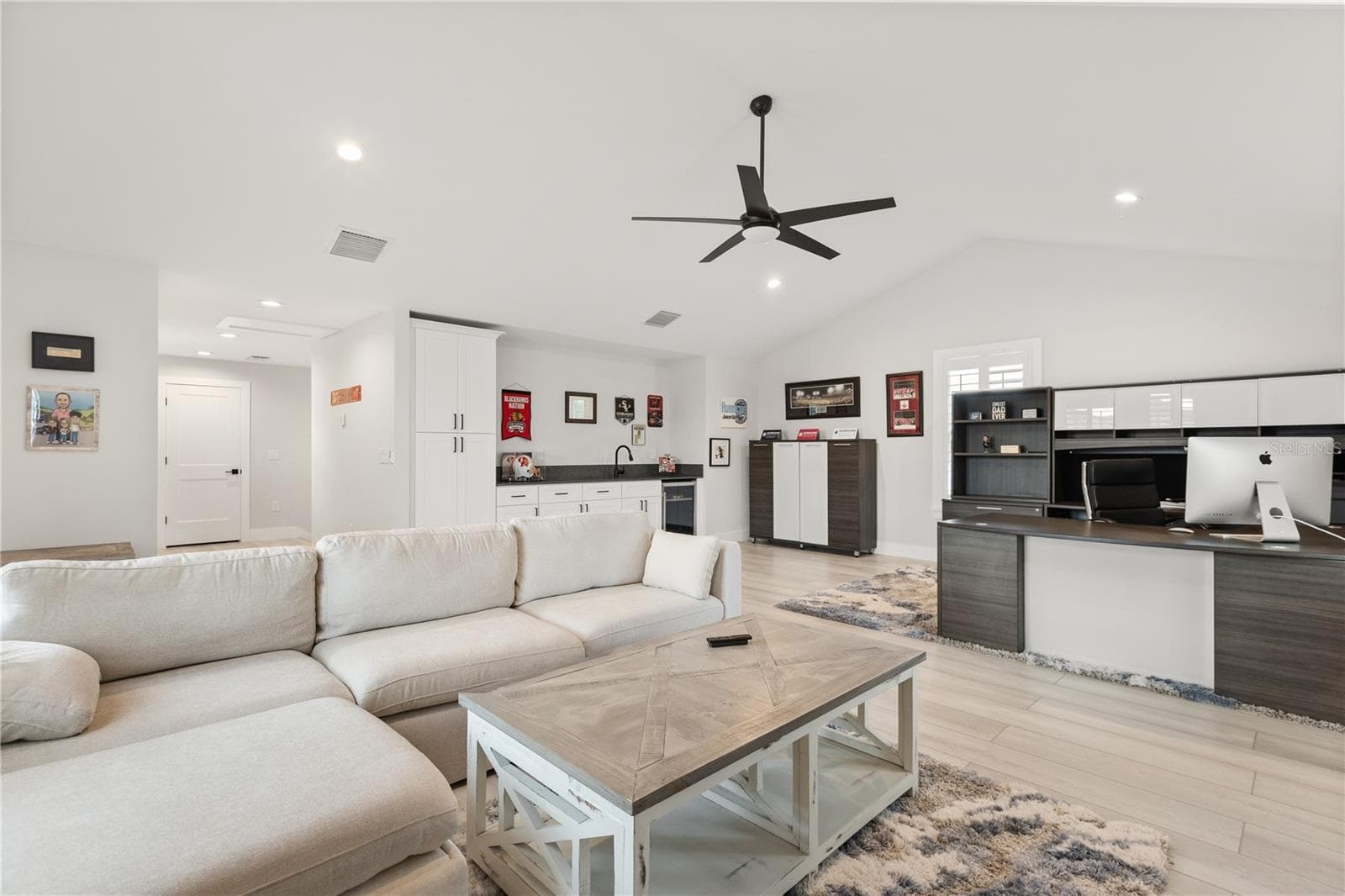 VAULTED CEILING + KITCHENETTEThe 907-square-foot carriage house apartment features a vaulted ceiling, kitchenette and expansive open floor plan with room for living, working and extended-stay accommodations. - 907 CELADON ST, WINTER GARDEN