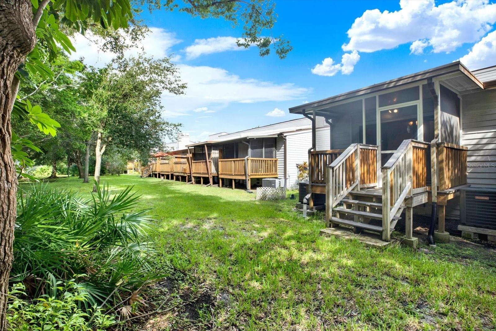 REAR SCREEN ENCLOSED PATIO WITH STAIRCASE - 6410 92ND PL N #1401, PINELLAS PARK