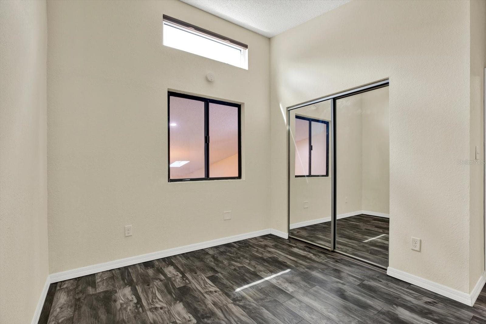 SECONDARY BEDROOM/ LARGE CLOSET AND LAUNDRY SHOOT - 6410 92ND PL N #1401, PINELLAS PARK