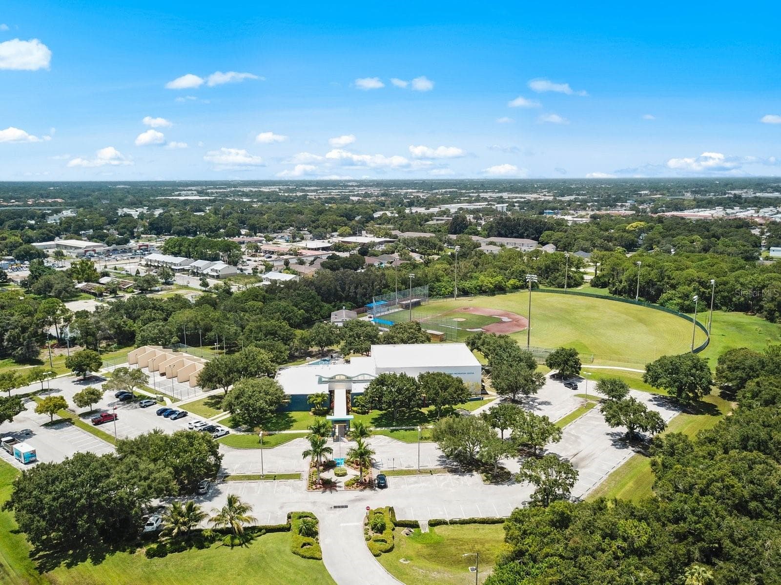 FORBES REC CENTER LOCATED ACROSS THE STREET OFFERS AFFORDABLE BEFORE & AFTER SCHOOL CARE AS WELL AS SUMMER PROGRAMS FOR THE CHILDREN AND OPEN TO THE PUBLIC FOR RENTAL FACILITIES, PARTIES, GATHERING ALSO RACQUETBALL COURTS - 6410 92ND PL N #1401, PINELLAS PARK