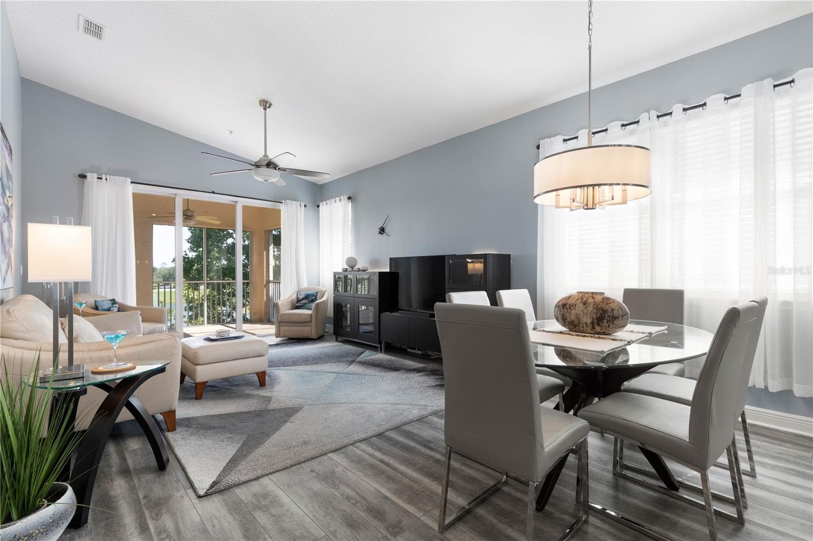Open Living/dining area with triple sliding glass doors - 65 RIVERVIEW BND S #1734, PALM COAST