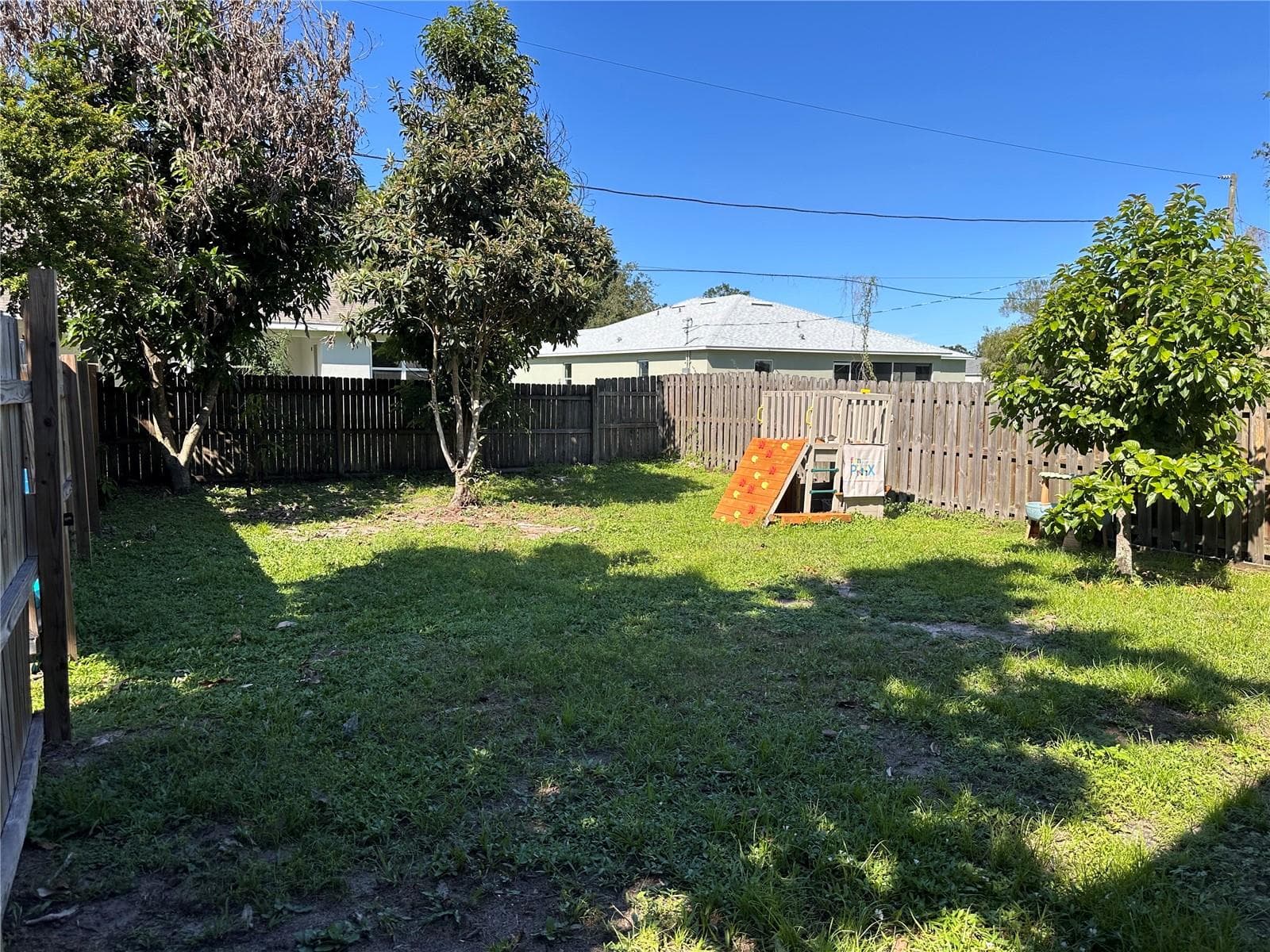 Right side of fenced area - 891 MERRIMAC ST SE, PALM BAY