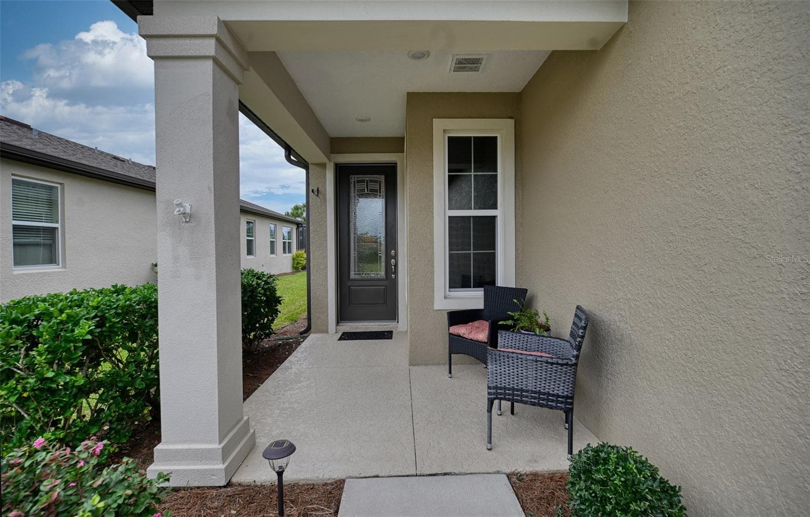 Front Entryway with Covered Porch & Front Door with Glass Insert - 5995 SW 93RD CIR, OCALA
