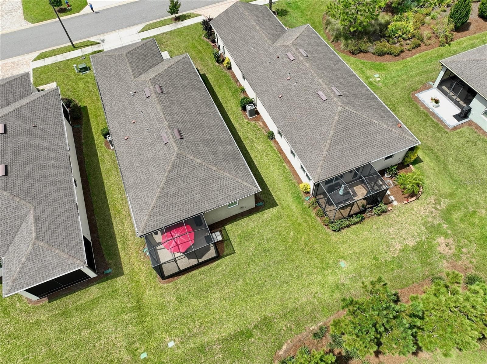 Aerial view from rear of home (red umbrella visible in screened cage) - 5995 SW 93RD CIR, OCALA