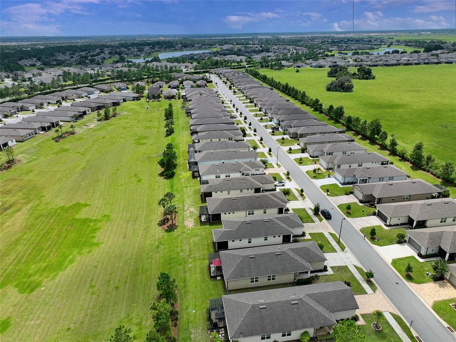 Aerial view of surrounding & dry retention areas from rear of home. - 5995 SW 93RD CIR, OCALA