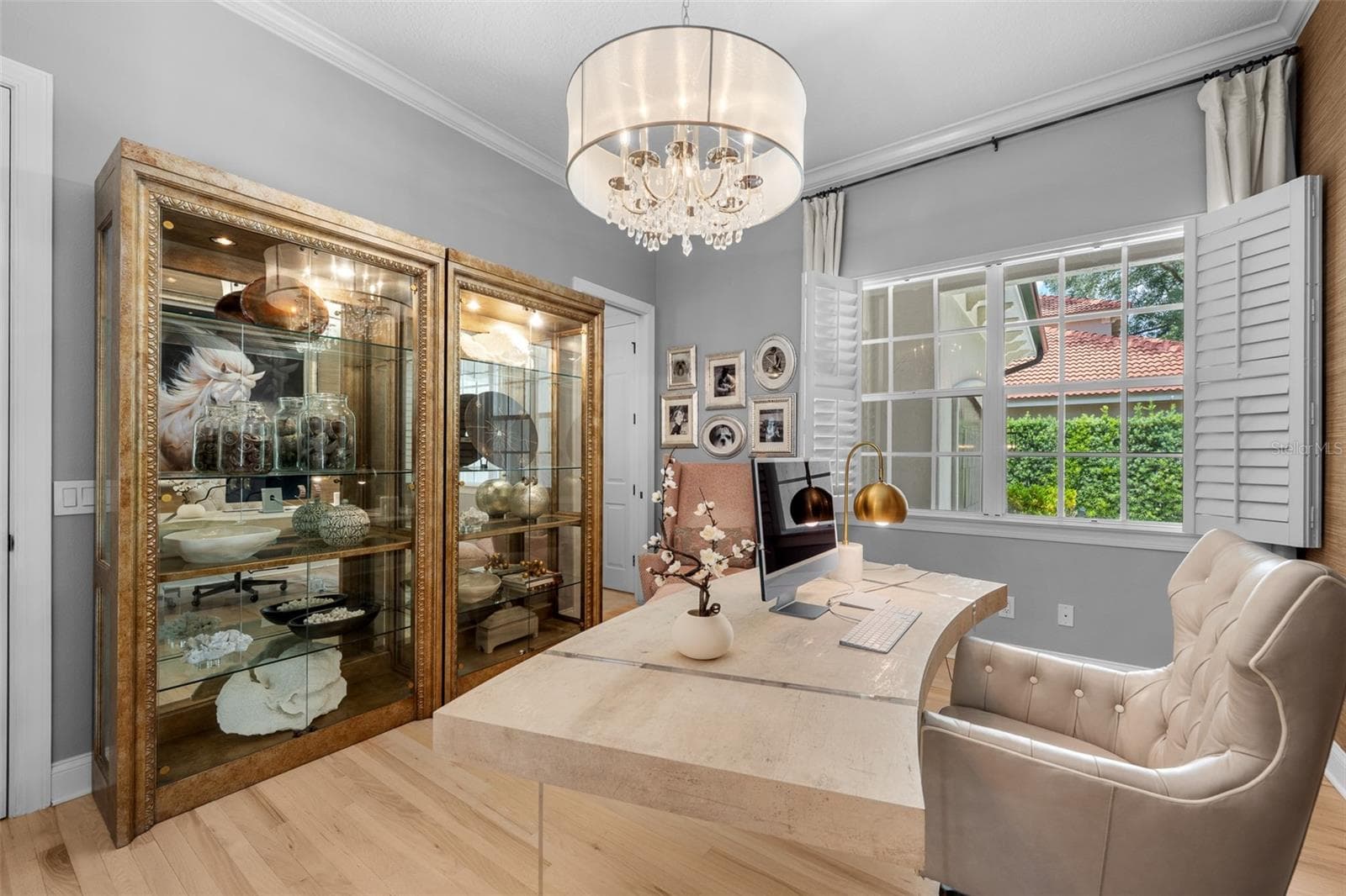 Den/Office — Built-in display cabinets and windows with plantation shutters. - 1921 FLORESTA VIEW DR, TAMPA