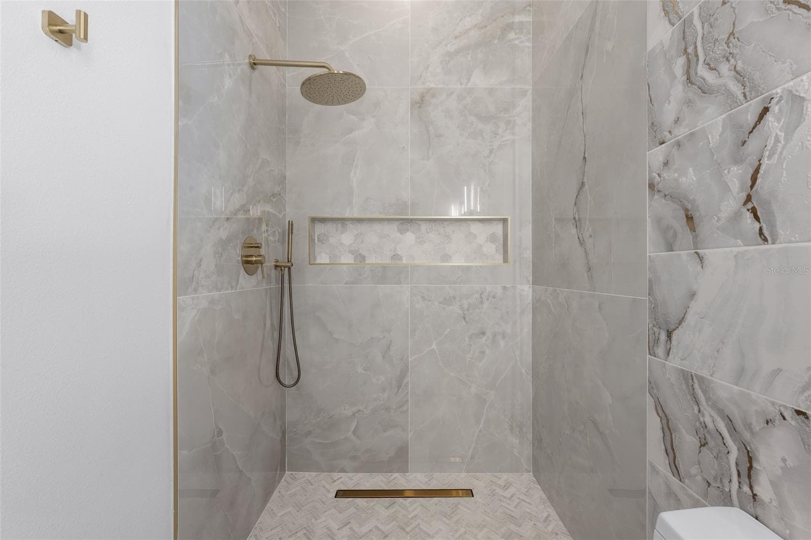 3rd Bathroom Walk-in shower with brass rain showerhead and wall niche. - 1921 FLORESTA VIEW DR, TAMPA