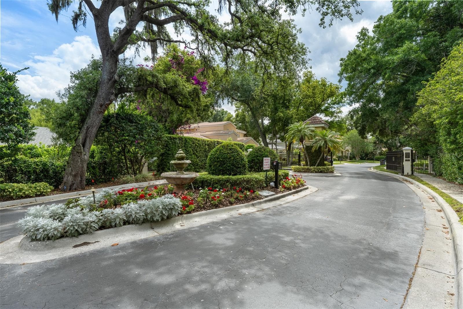 Community entrance — Landscaped gated community entrance. - 1921 FLORESTA VIEW DR, TAMPA