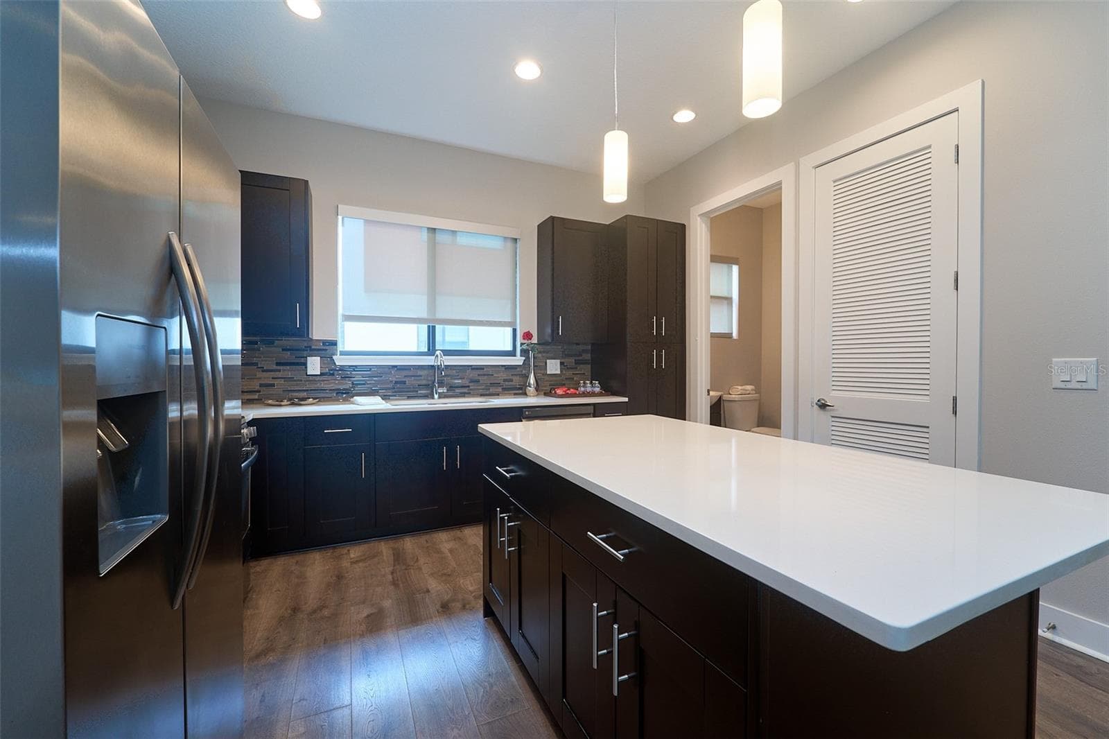 kitchen with island and Quartz counters - 136 8TH ST N, ST PETERSBURG