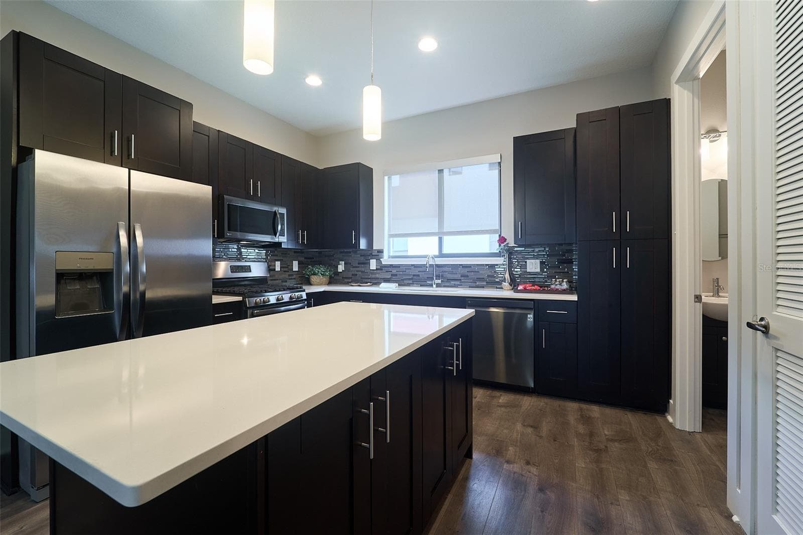 kitchen with stainless steel appliances - 136 8TH ST N, ST PETERSBURG