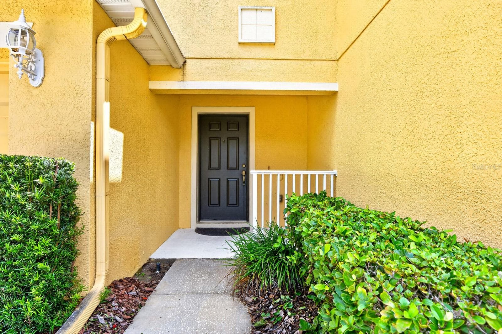 Covered front porch entry. - 4559 LACEBARK TRL, OVIEDO