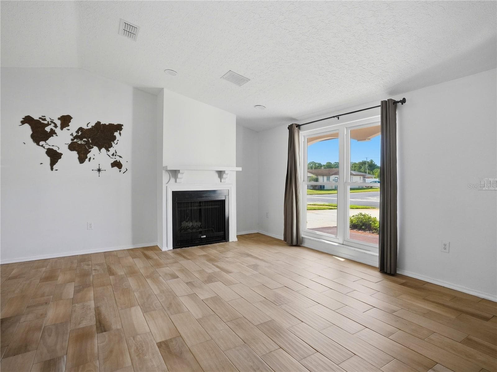Wood-burning fireplace for the wintertime. - 6743 LARCHMONT AVE, NEW PORT RICHEY